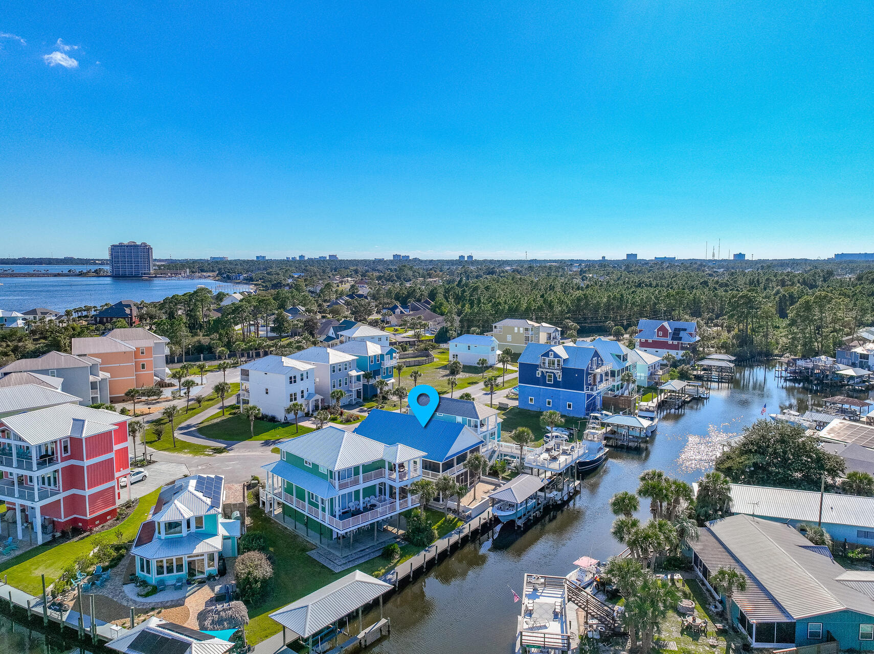 Stunning Waterfront Home with Gulf Access and Deep Water Boating Amenities.  Don't miss this incredible opportunity to own a newly renovated waterfront retreat with direct access to the Gulf! Situated in a secluded, gated community, this home is a boater's paradise, complete with a deep-water boat slip and boathouse.  Step outside to enjoy Florida's fabulous weather on two oversized, southern-style screened porches--perfect for entertaining family and friends. Inside, the home features exquisite finishes, including light sand-colored quartz countertops in the kitchen and bathrooms, complemented by immaculate white cabinetry and modern gold hardware for a clean, sophisticated look.