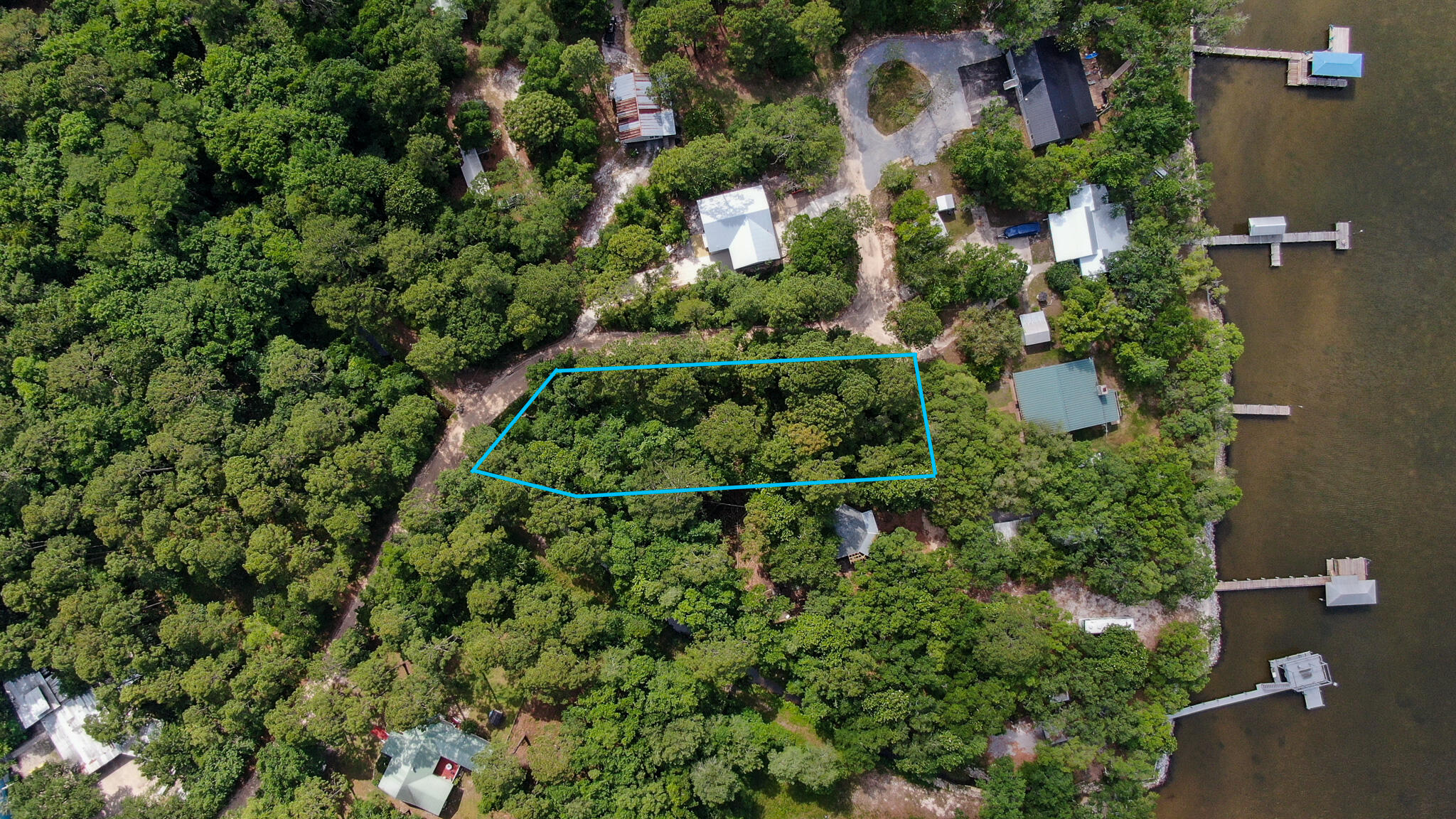 Large lot 0.64-acre one tier off the bay to build up and should capture views of the bay. No HOA or build out time frame. Upgraded county park located under the Hwy 331 bridge which offers boat launch, restrooms, and fishing is within a mile from this lot. There are several restaurants close by or you can travel south a short distance to the beach, shopping and several more restaurants.