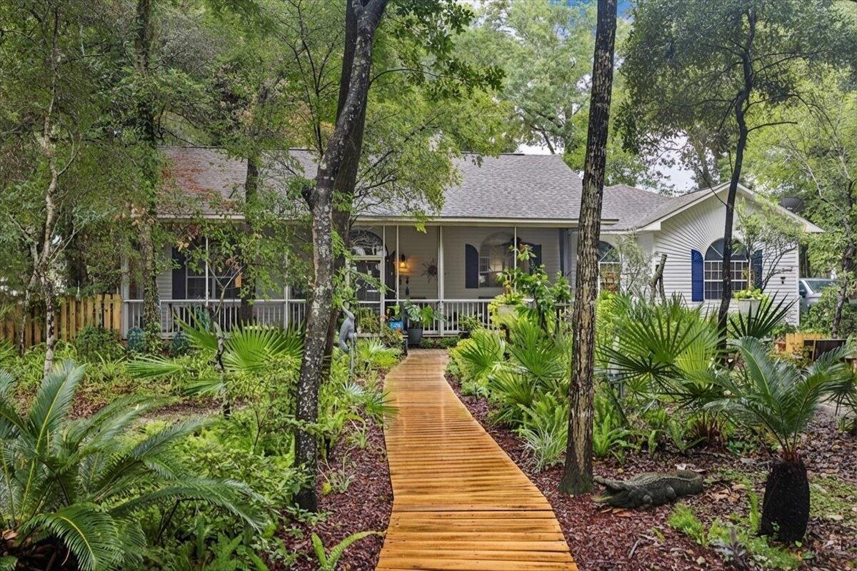 198 N Blue Heron Drive is a beautifully maintained home located in the picturesque bayfront community of Fischer's Landing. Nestled within an intimate 27-home enclave centered around a quiet cul-de-sac, this neighborhood offers exceptional privacy, minimal traffic, a private community bayfront dock, and a close-knit atmosphere that captures the timeless charm and tranquility of Old Florida.
Situated on an oversized lot shaded by majestic century-old live oaks, the property provides a peaceful setting that is increasingly rare to find. Outdoor living is a highlight, with a welcoming screened front porch, spacious Florida room, and private rear patio--perfect for enjoying the natural surroundings and entertaining family and friends. Inside, the thoughtfully designed 3-bedroom, 2.5-bath floor plan offers generous living spaces and an open layout ideal for both everyday living and hosting guests. The home is move-in ready and has been well maintained, featuring a new roof (2017), HVAC system (2018), and water heater (2026). Completing the property is a two-car garage with an attached workshop, providing ample storage and space for hobbies or projects. Combining privacy, community amenities, mature landscaping, and all that The Emerald Coast has to offer, this is the kind of home that is meant to be enjoyed for years to come.