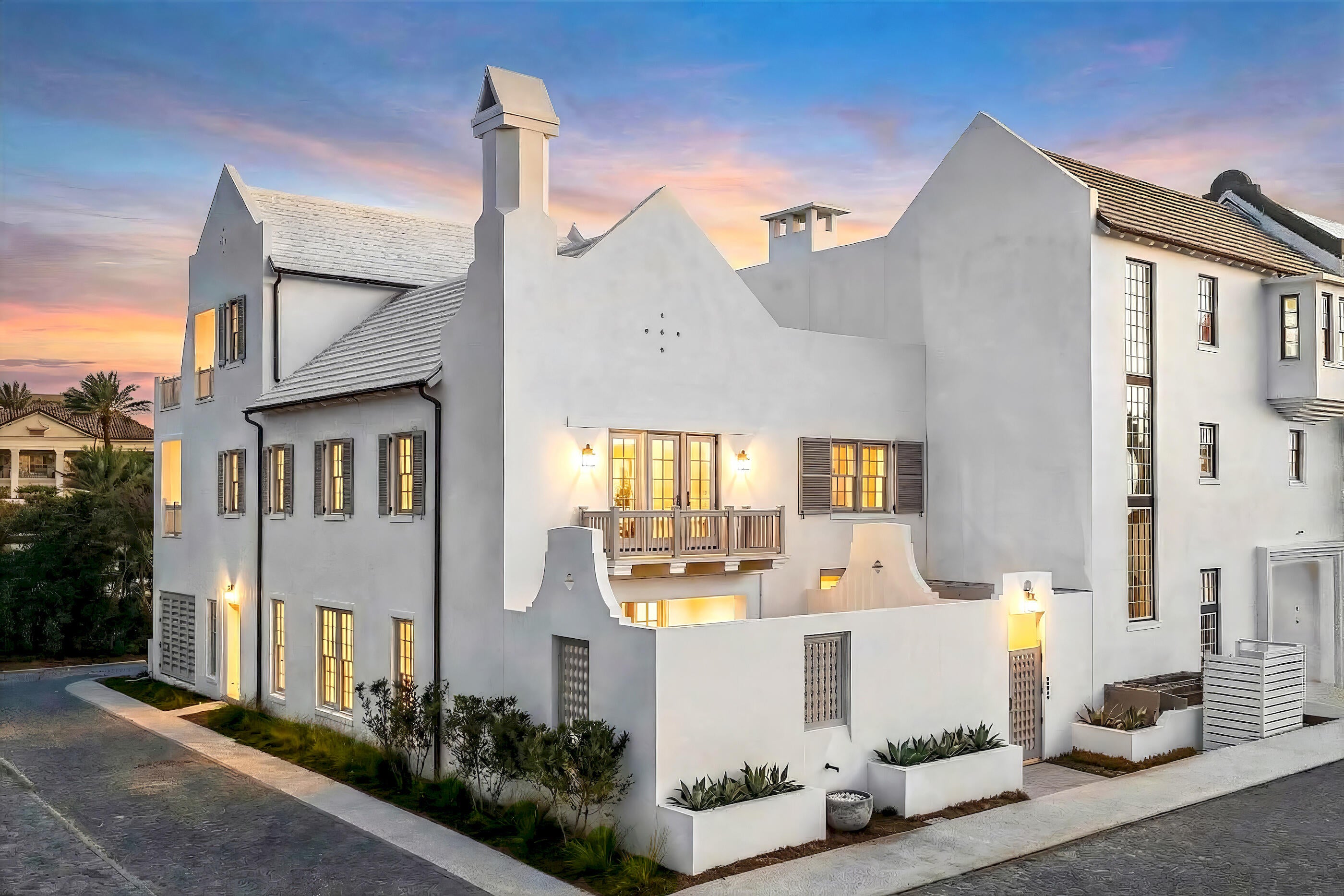 In Alys Beach, architecture is part of the experience, and 155 Elbow Beach Road is a residence that fully understands the assignment. Designed and built by Brian Spence, this three-story home pairs Mediterranean influence with the clean, sculptural aesthetic that defines one of 30A's most distinctive communities. Across 5,263 square feet, five bedrooms and six and a half baths are arranged around a series of beautifully considered interiors, private retreats, and outdoor living spaces that feel both composed and effortless. Inside, Venetian plaster walls, designer lighting, and a fully furnished interior create a quiet sense of luxury shaped by texture, proportion, and restraint. The main living spaces are generous without feeling oversized, designed to support both intimate daily living and larger gatherings with equal ease. An in-home elevator connects all three levels, adding convenience without interrupting the home's architectural rhythm.

At the center of the residence, the kitchen is both polished and highly functional, appointed with Sub-Zero and Wolf appliances, substantial prep space, and a layout that keeps cooking, conversation, and entertaining naturally connected. The surrounding living areas carry the same attention to detail, creating an environment that feels elevated while remaining comfortable and deeply livable.

The primary suite is conceived as a private retreat, with a spa-inspired bath highlighted by dual steam showers and refined finishes. Guest accommodations throughout the home provide privacy and flexibility, making the residence well suited for both full-time living and extended stays with family and friends.

Outside, the home shifts seamlessly into resort-style living. A heated private pool and hot tub anchor the courtyard, complemented by fountains, a fireplace, a Wolf grill, an outdoor shower, and multiple lounge and terrace areas. The result is a layered outdoor environment designed for long afternoons, evening gatherings, and the kind of indoor-outdoor living that defines life along 30A.

From the third floor, Gulf views extend the experience outward, bringing the water into the daily rhythm of the home and creating a natural backdrop for sunsets and coastal evenings. Garages with ceiling heights designed to accommodate vehicle lifts add another level of thoughtful functionality, offering flexibility for additional vehicle storage without compromising the home's design.

Fully furnished and exceptionally considered, 155 Elbow Beach Road offers a compelling opportunity to own a luxury home in Alys Beach where architecture, materiality, outdoor living, and Gulf views come together with remarkable clarity. For buyers searching for a furnished residence in Alys Beach, a second home along Scenic Highway 30A, or a sophisticated coastal retreat with a private pool, elevator, and resort-style courtyard, this home delivers an experience that feels distinctly and unmistakably Alys Beach.