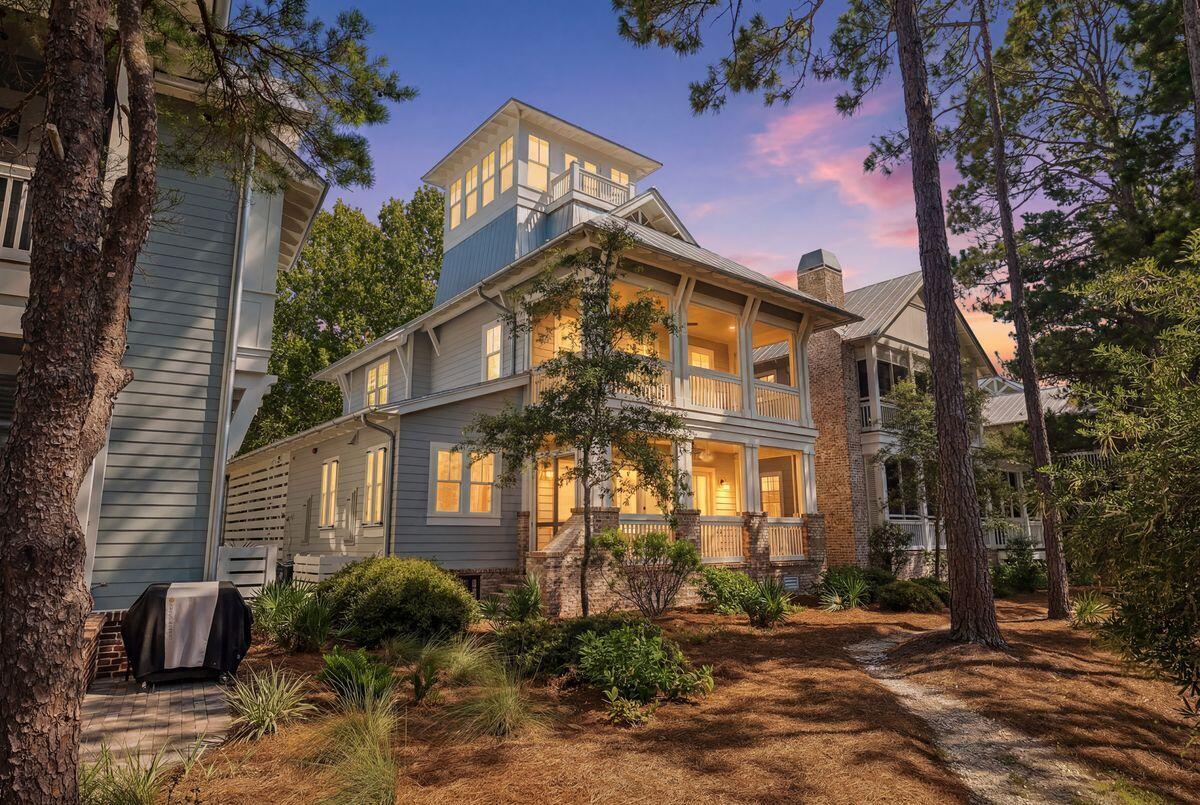 Nestled on a prime lakefront homesite in the gated community of Forest Lakes, this custom-built residence by Luke & Blues Custom Homes, designed by the acclaimed Archiscapes Architects, offers an exceptional blend of timeless architecture, luxury finishes, and an unrivaled waterfront setting. Lovingly maintained by its current owners and never offered as a rental, this impeccably cared-for home presents with a level of freshness rarely found along 30A. Situated on a quiet cul-de-sac overlooking the community's picturesque lake, it captures tranquil water views from multiple levels while being just moments from the sugar-white beaches and renowned dining along Scenic Highway 30A.

Designed for effortless coastal living and entertaining, the thoughtfully crafted floor plan features four spacious bedrooms, four full baths, a third-floor bonus room with full bath, and an iconic fourth-floor tower offering panoramic treetop and lake views. The open-concept living, dining, and kitchen spaces are highlighted by wide-plank wire-brushed oak flooring, shiplap walls throughout, abundant natural light, and an impressive 18-foot Eurowall six-panel folding glass door that seamlessly opens the living room to the expansive screened porch overlooking the water. The chef's kitchen is beautifully appointed with quartz countertops, a Wolf gas range, Fisher & Paykel double-drawer dishwasher, farmhouse sink, wine refrigerator, ice maker, drawer microwave, custom cabinetry, handcrafted subway tile backsplash, under-cabinet lighting, oversized island, and generous pantry storage.

The serene primary suite enjoys its own private screened porch overlooking the lake, a custom-designed walk-in closet, and a luxurious spa bath featuring marble finishes, dual vanities, and an oversized shower with rain, wall, and handheld shower systems. Every bedroom offers exceptional comfort with custom closet systems and beautifully finished baths, while the versatile third-floor bonus room provides additional space for guests, a home office, or media room.

Every detail reflects quality craftsmanship, including upgraded designer lighting, custom window treatments, whole-house sprinkler and security systems, two Rinnai tankless water heaters, built-in speakers, hidden storage, and extensive custom millwork throughout. The charming tower retreat, surrounded by fourteen windows with remote-controlled shades, opens to a private balcony where sweeping lake and sunset views create the perfect place to unwind.

Forest Lakes is one of 30A's most sought-after gated communities, offering a rare combination of privacy and convenience with resort-style amenities including a two-tier pool, pavilion with outdoor fireplace and grilling area, playground, walking trails, expansive green spaces, and a scenic boardwalk spanning the lake. With no short-term rental restrictions, this remarkable residence is equally suited as a primary home, vacation retreat, or exceptional investment opportunity.

Custom designed, expertly built, and positioned on one of Forest Lakes' premier lakefront homesites, 68 Okeechobee Circle represents a rare opportunity to own one of the community's finest residences.