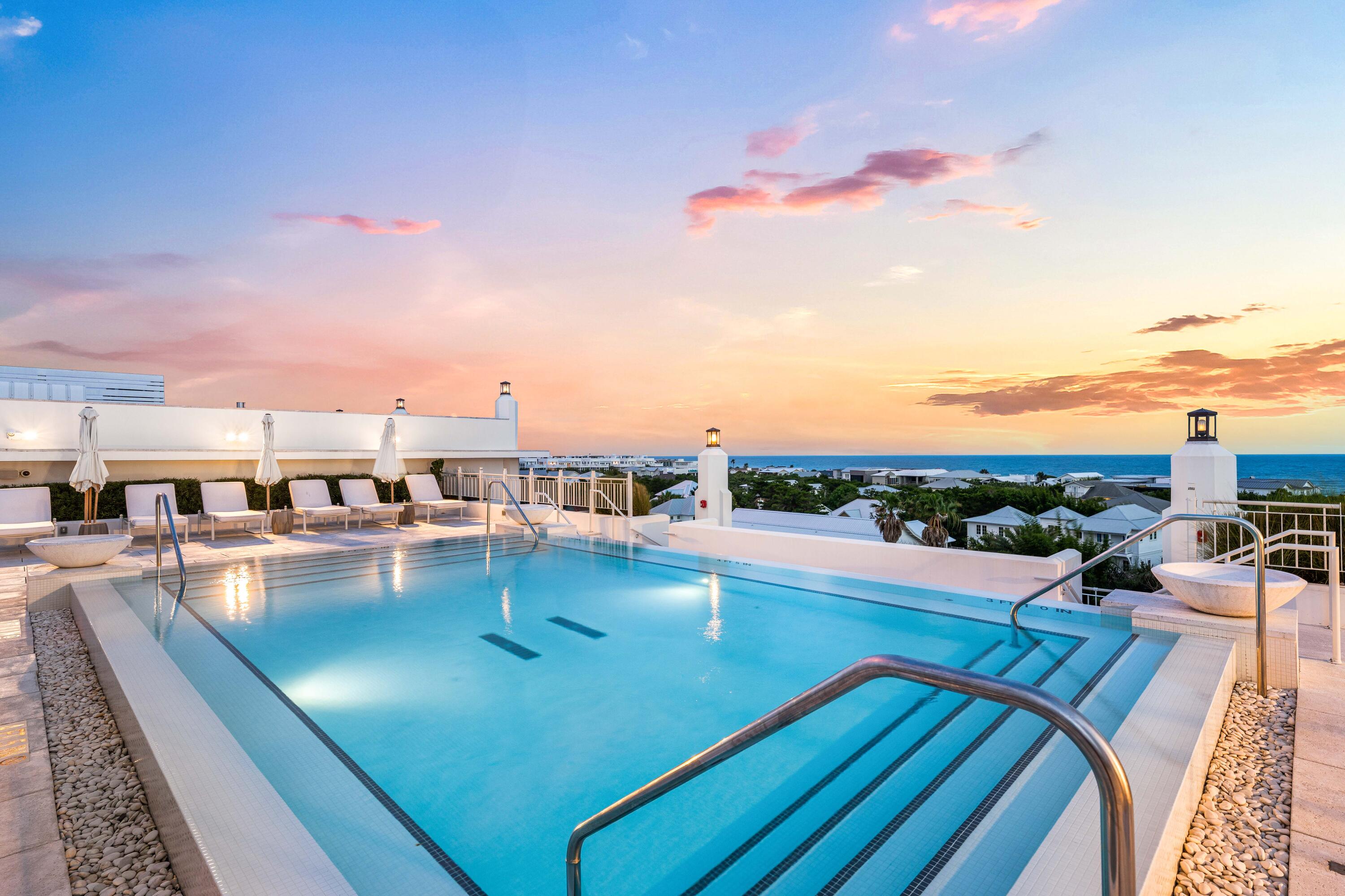 Positioned on the third floor of Kaiya Club Residences, Unit 307 offers 1,358 square feet of Gulf-view living with a fully furnished interior ready to enjoy from arrival. Gulf views extend from the great room through the primary suite and out to the covered balcony -- a consistent outlook that distinguishes this residence within the building.
The covered balcony is a genuine outdoor room. Deep, tiled in large-format stone, and furnished in teak -- high-top dining, barrel lounge chairs, and a chaise -- it looks south across the 30A roofline to the Gulf and west toward the white architecture of Alys Beach. Two distinct seating areas make it equally suited for morning coffee and evening entertaining.
Inside, French doors open the great room directly to the balcony, with wide-plank hardwood floors running throughout. Slipcovered sofas, a solid walnut coffee table, and upholstered accent chairs -- all Restoration Hardware, all conveying with the sale -- give the space a settled, editorial quality that arrives fully formed.
The chef's kitchen is anchored by a Wolf professional gas range set against a full-slab backsplash, with Sub-Zero refrigeration and full-height flat-panel cabinetry in dove grey. An oversized quartz island with shiplap-wrapped base seats four beneath a statement brass ring pendant. Just off the kitchen, a dedicated wet bar with under-lit glass-front cabinetry, quartz counter, and bar sink is designed for seamless entertaining without disrupting the main kitchen. Both bathrooms are finished entirely in Carrara marble. The primary bath features a dual vanity with fluted cabinetry and a walk-in rain shower. The guest bath continues the same marble palette with a full soaking tub under a glass enclosure -- a detail more at home in five-star hospitality than a residential condominium.
The primary suite opens through French doors directly to the balcony with Gulf views from the bed. The secondary bedroom is equally refined, with hardwood floors and ample closet storage.

Kaiya Club membership is available separately at an additional cost and provides access to the rooftop pool, sun deck, Wolf outdoor kitchen, and the private Gulf-side beach house -- a complete resort amenity package for those who want the full Kaiya experience. The Kaiya grounds feature a formal cobblestone arrival, illuminated fountain gardens, and a fire feature courtyard. Directly adjacent to Alys Beach, minutes from Rosemary Beach, and steps from the 19-mile 30A bike path.
