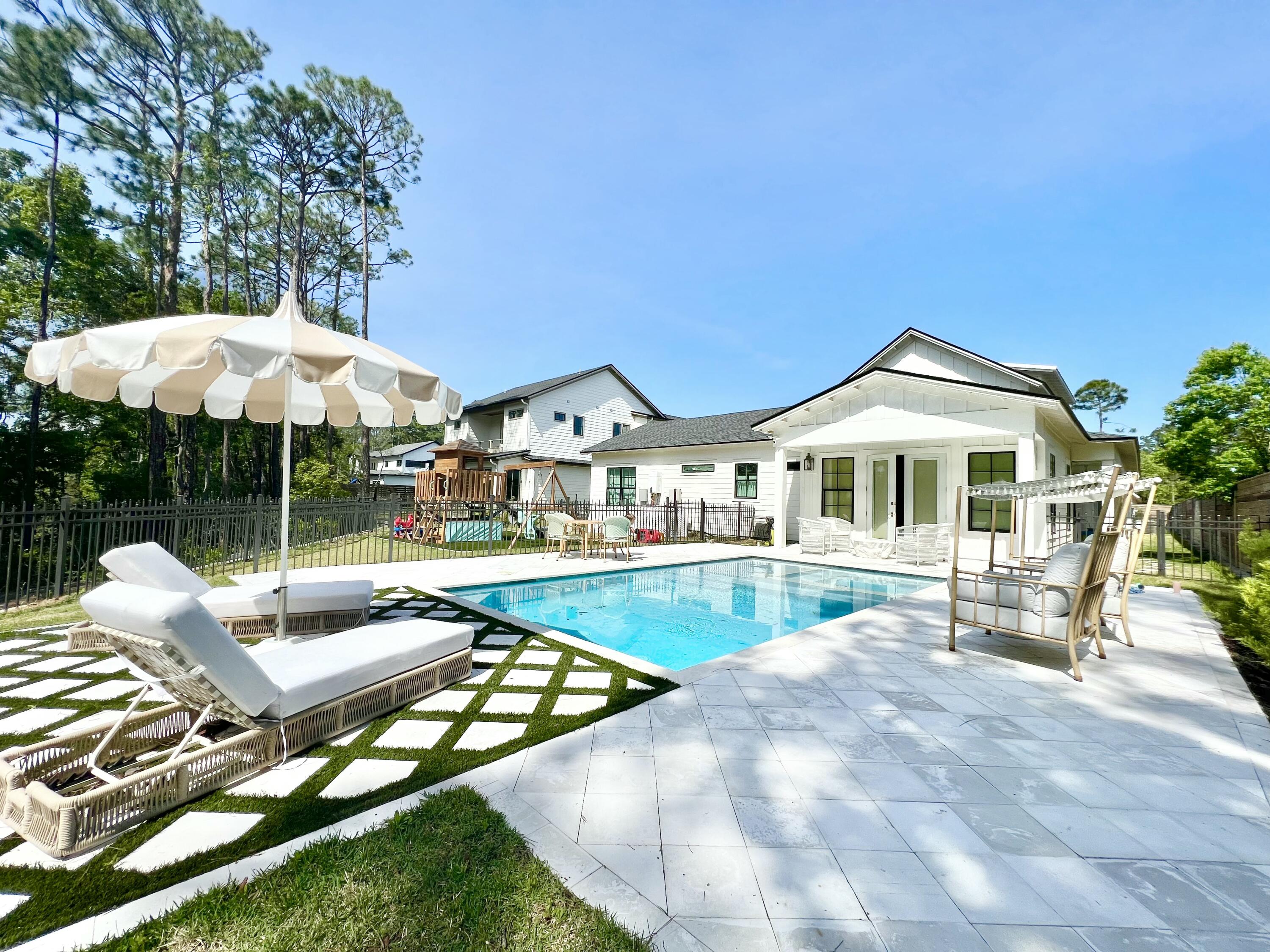 Embrace tranquility in the perfect family, second, or retiree home, where a picturesque cul-de-sac setting meets the bayou. Discover 107 ft of spacious canal water frontage with views of Mack Bayou. This one-story sprawling ranch encompasses 4 beds, 4.5 baths, and is set on .59 acres. Entertain effortlessly in the expansive kitchen/living/dining area, adorned with ceilings over 20 feet high or step onto the large covered front and side porches, ideal for alfresco dining or simply savoring the peaceful views. Experience the custom interior finishes that elevate every corner of the home. Each bedroom offers the an en-suite bathroom, ensuring privacy and comfort for all residents and guests. Quotes are currently currently being drawn up for a proposed boat dock.