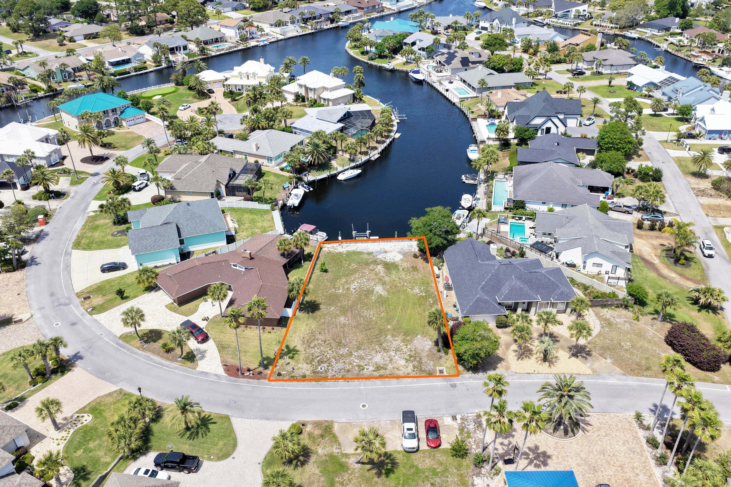 Water, power and boat lift already in place for you! Bring your boat now and build your dream waterfront home later! This is one of the few remaining deep-water canal homesites available in the gated community of Bay Point. Ready for construction, the property is already equipped with water, power, and a boat lift, saving valuable time and significant development costs. An added bonus is its ideal positioning, offering long, picturesque views down the canal rather than directly across, creating a more open and impressive waterfront setting. House plans are available, making it even easier to bring your vision to life. Enjoy direct deep-water access from your dock to the Gulf, whether you're heading out for a day of fishing, cruising to Shell Island, or simply enjoying life on the water. Bay Point is one of Panama City Beach's premier gated communities, featuring 24-hour security, a Jack Nicklaus championship golf course, a full-service marina, on-site dining, and beautifully maintained grounds. Conveniently located just minutes from St. Andrews State Park, Shell Island, shopping, restaurants, and the sugar-white beaches of the Gulf Coast. Rare opportunities like this don't come along often. Build exactly what you've been dreaming of in one of the area's most desirable waterfront communities. Seller is a Florida licensed real estate agent.