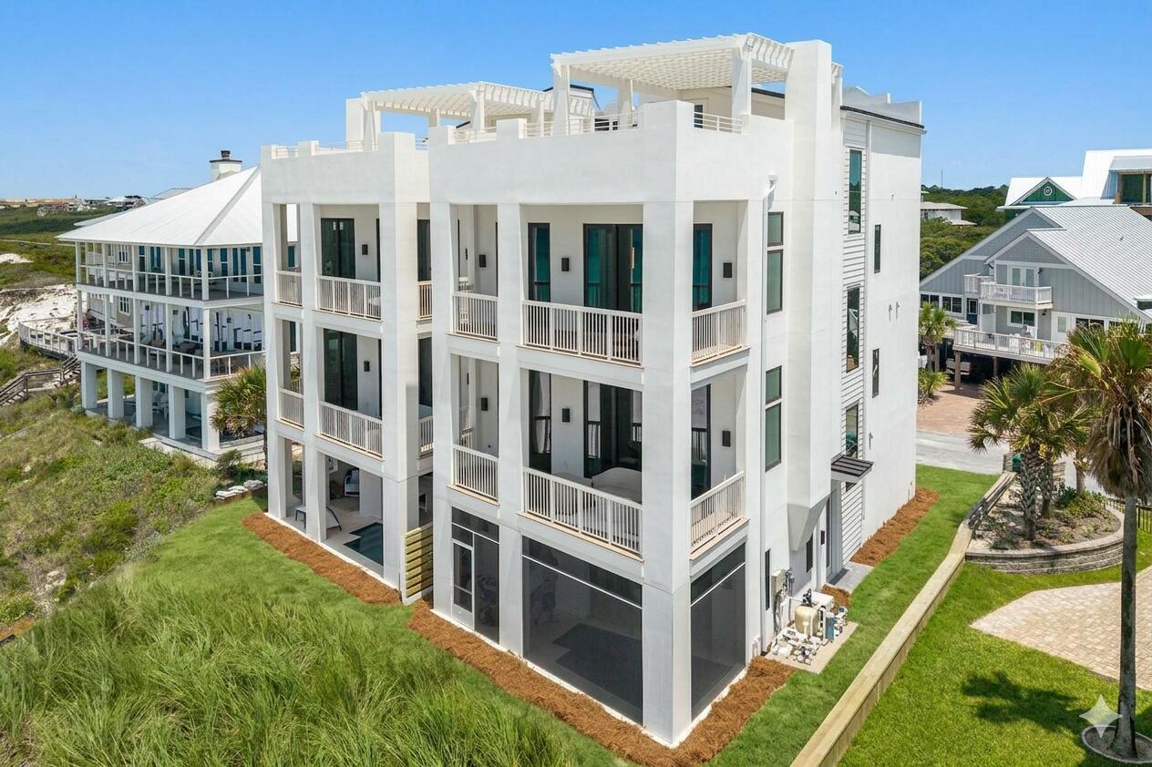 Words only begin to capture the essence of this newly constructed, gulf-front masterpiece. Locted within Gulf Trace--one of 30A's most secluded, coveted, and tightly held beachside enclaves--this new home redefines the standard for coastal luxury. Every square inch of this residence was meticulously envisioned and masterfully executed, balancing robust structural integrity with sophisticated, high-end design.  Moving through the home, the level of finish is an absolute testament to the owner's flawless vision and uncompromising eye for detail. Eschewing standard builder grades, the owner personally curated every design element to create an atmosphere of refined, organic luxury.  Precision craftsmanship shines throughout.  A soothing, sophisticated coastal palette flows seamlessly across the home and features exquisite quartzite countertops and intricate, custom-tiled backsplashes.  The kitchen features modern cabinetry, an oversized prep island, and top-tier luxury appliances integrated seamlessly to please the most discerning culinary enthusiast. Catering and grand-scale entertaining are handled effortlessly via a hidden, walk-in scullery that keeps prep work out of sight.  Effortless movement throughout this residence is guaranteed by a premium residential elevator, providing mechanical access to all four levels of the home. This highly coveted feature ensures that everyone, from young children to multi-generational guests, can transition flawlessly from the ground floor up to the crowning jewel of the property: a spectacular rooftop terrace. From this elevated vantage point, enjoy unparalleled, unobstructed 180-degree views stretching from the twinkling lights of Destin all the way to Panama City Beach--an ideal sanctuary for witnessing unforgettable 30A sunsets.  

Designed to blur the line between indoor luxury and outdoor paradise, the residence features a gulf-front pool deck seamlessly integrated with a screened lanai. This outdoor oasis serves as the perfect backdrop for open-air dining, coastal entertaining, or quiet relaxation over the emerald waves.

The intuitive floor plan is optimized for both grand-scale entertaining and intimate family living. The home boasts multiple distinct living areas, offering effortless traffic flow and premium privacy. Accommodating guests is a breeze with five expansive bedrooms, each featuring its own dedicated ensuite bathroom finished with spa-like fixtures and premium stone. 

More than just a house, this rare architectural achievement offers an incomparable legacy lifestyle. It stands ready to host generations of family gatherings, deliver years of cherished memories, and provide a lifetime of pure coastal joy to its discerning new owner.