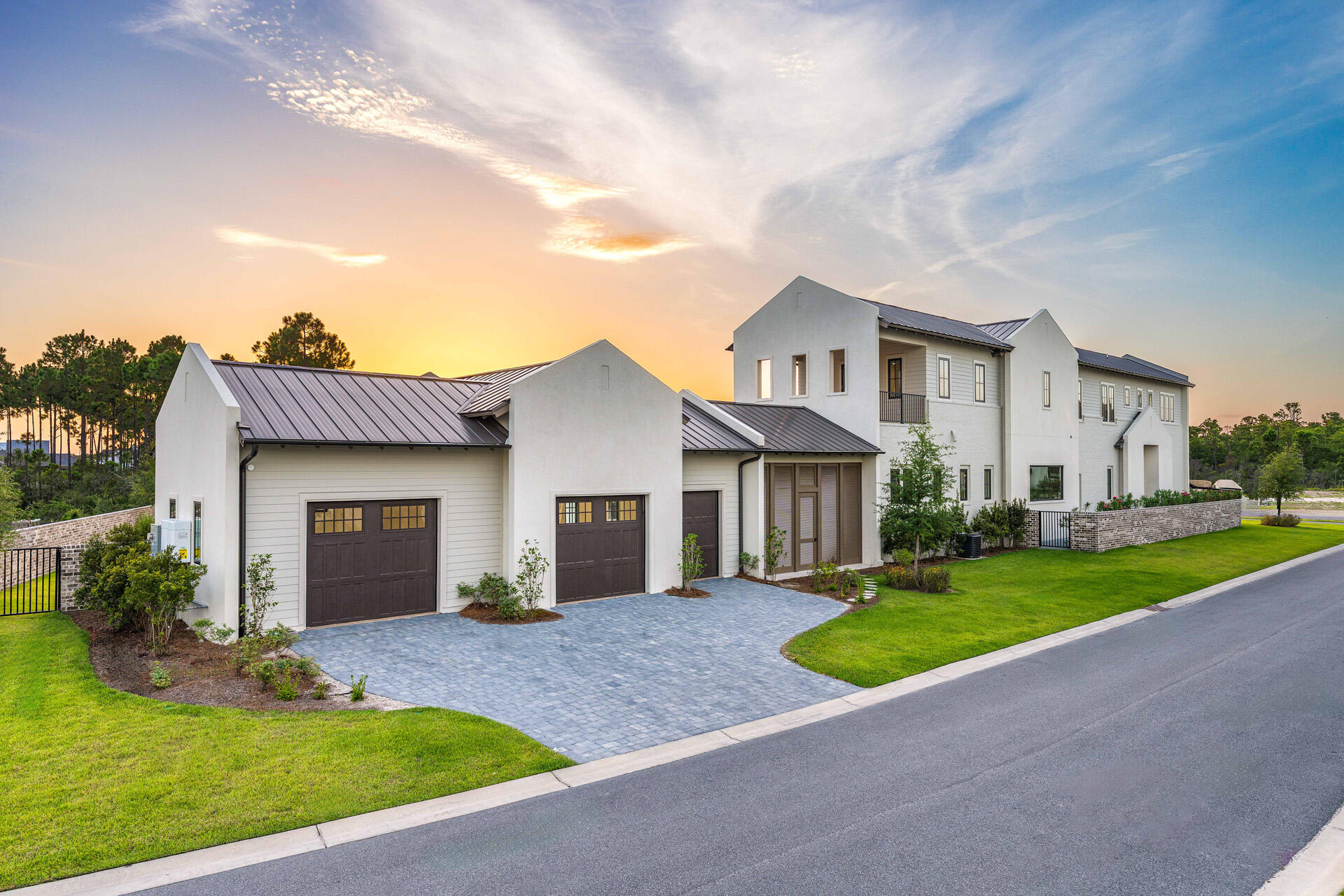 A showstopper of modern coastal elegance, 36 Sandcord Drive is a brand-new luxury estate within the gated enclave of Watersound Camp Creek. Spanning 6,065 square feet with five bedrooms and six-and-a-half bathrooms, this two-story residence was designed to live like a private resort. The exterior showcases a refined blend of white stucco, brick, and cedar lap siding, while a brick courtyard wall and mahogany entry doors create an impressive sense of privacy and arrival. Inside, a private elevator, dedicated office, and dramatic living room with vaulted ceilings and architectural columns open to an exceptional backyard sanctuary. The resort-style pool features a wall fountain, sun shelf, and swim-up serving area connecting directly to the outdoor kitchen and bar. The outdoor kitchen materials and appliances have been delivered, and installation is underway. A dedicated gas connection is also in place for the future addition of a fire-lounge feature, allowing the next owner to further customize the pool deck for evenings of outdoor relaxation and entertaining. The oversized corner lot is framed by a wraparound driveway, lush landscaping, and two elegant courtyards, including an entry courtyard with a tranquil fountain. The home offers three generously appointed primary suites-two conveniently located on the first floor and a third upstairs.

The main first-floor primary suite encompasses the home's entire west wing, creating a private retreat with vaulted ceilings, a stone fireplace, direct access to the pool deck, two spacious walk-in closets, a separate dressing room, and an additional washer and dryer hookup. Its spa-inspired bathroom features a freestanding soaking tub, an expansive open walk-in shower, and a distinctive freestanding double vanity positioned away from the wall, allowing access from both sides while facing a full mirrored wall.

A second primary suite is located on the opposite side of the first floor and offers its own private courtyard access. Its beautifully appointed ensuite bathroom includes dual vanities, a freestanding soaking tub, and a spacious walk-in shower, providing guests or multigenerational family members with the comfort and privacy of a true primary retreat.

Upstairs, three additional bedrooms each feature private ensuite bathrooms. Two include vaulted ceilings, while the pool-facing bedroom serves as the home's third primary suite. This spacious upper-level retreat features vaulted ceilings and a private balcony with water views overlooking the pool deck and backyard. Its impressive bathroom is complete with dual vanities, a freestanding soaking tub, and a full walk-in shower.

Thoughtful architectural details, premium finishes, and generously proportioned spaces throughout create a seamless balance of luxury, comfort, and everyday livability. From the three private primary suites and elegant courtyards to the resort-inspired outdoor setting, every element has been designed for elevated coastal living.

Located behind the exclusive gates of Watersound Camp Creek, ownership offers more than an extraordinary home-it provides access to one of Northwest Florida's most sought-after lifestyles. Property ownership includes eligibility for the Watersound Club, with membership options offering access to an array of amenities that may include private beach experiences, championship golf, pools and a lazy river, wellness facilities, tennis, pickleball, and signature dining venues.

36 Sandcord Drive is more than a residence-it is a statement of refined living and timeless comfort along Florida's Emerald Coast. Experience privacy, luxury, and an entertainer's dream within the exceptional Watersound Camp Creek community.