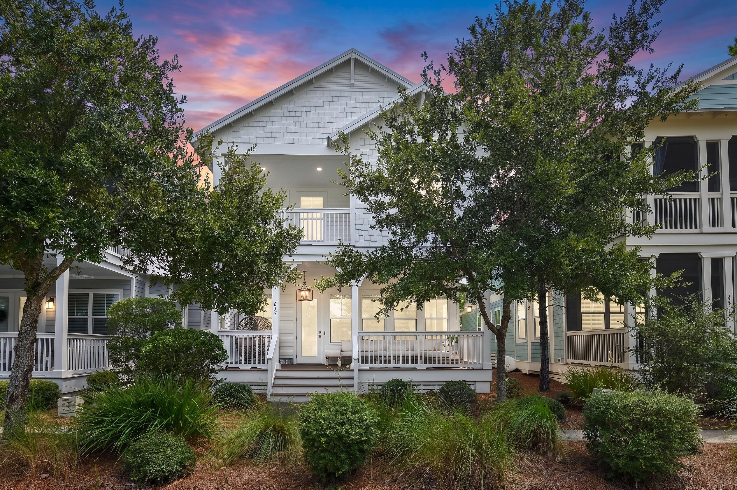 Located in NatureWalk at Seagrove, directly adjacent to WaterColor and 1.5 miles from Seaside's Central Square. This 4-bedroom, 3.5-bath 'Wind Song' layout sits on a lot that backs directly to community green space with no rear neighbors. Everyday convenience: Quick golf-cart ride to WaterColor Crossings (Publix, dining, shopping). Beach access: Direct bike/walk path via the Lilly Lane trail through Point Washington State Forest to the Santa Clara regional beach access. Neighborhood amenities: The Gathering Place features a zero-entry pool, heated lap pool, hot tub, pickleball/sports courts, and fire pits. Property specs include hardwood floors throughout, GE Café appliances, granite countertops, subway tile, impact-resistant windows and doors, 2x6 exterior framing, and an outdoor shower. Works well as a second home or vacation rental. You'll enjoy numerous porches for morning coffee or afternoon wind down time.  There are sidewalks, paths and tree lined streets.