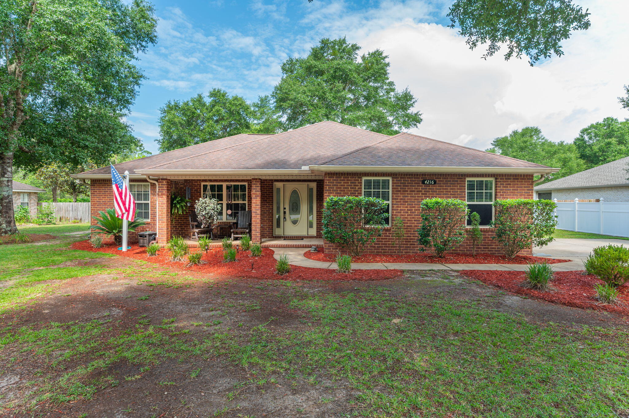 Take a look at this Exceptionally Kept home. All Brick with a two car side entry garage with beautiful curb appeal. Out back you'll find an extremely large back yard, perfect for entertaining or gardening. Extra storage and another carport for storing your boat, utility vehicle or lawn equipment. Inside this beautiful home is a large family room with an electric fireplace and a surround sound that conveys with home. Beautiful tiles floors in kitchen and family room. Upgraded wood laminate floors in the bedrooms. No carpet for those that may have allergies. Nice kitchen with a dining room and breakfast area. Very spacious Primary Suite and the primary bath has a gorgeous tiled shower, soaking tub and dual vanity. The other two bedrooms are ample sized and shares another full bath. Garage has epoxy floors and very clean. You have to come and look at this home to appreciate all that it has to offer. Make your appointment today!