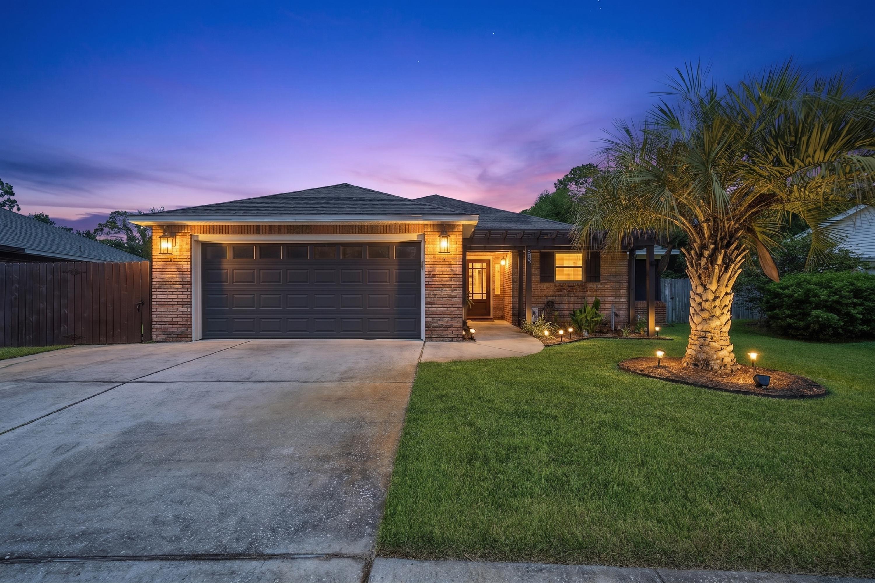 This beautifully updated home blends modern style with comfortable living, offering thoughtful upgrades inside and out. From the moment you arrive, you'll be welcomed by a charming pergola-covered entry that leads into a completely renovated interior with fresh paint and a bright, contemporary feel.

The kitchen has been beautifully remodeled with white shaker cabinetry, granite countertops, a large center island, stainless steel appliances, and a custom wine bar complete with a wine refrigerator; perfect for entertaining. The living area features attractive wood-look tile flooring, while the bedrooms offer the warmth and comfort of new carpet. An electric fireplace with a custom feature wall creates a stylish focal point in the main living space.

Both bathrooms have been updated with granite-topped vanities, new fixtures, and beautifully tiled tub and shower surrounds, giving the home a clean, modern finish.

Step outside and enjoy your own private backyard retreat. The spacious deck has been expanded and is ideal for entertaining, complete with electrical already installed for outdoor gatherings. Relax year-round in the included swim spa and hot tub, or enjoy your morning coffee from the screened porch or pergola-covered patio. Pristine landscaping, a sprinkler system, and a well-maintained exterior complete the outdoor space.

Major updates provide additional peace of mind, including a roof replaced in 2020, water heater replaced in 2020, HVAC replaced in 2023, and a generator hookup installed by the seller.

Located in the desirable Indian Woods community, you'll enjoy being just minutes from Choctawhatchee Bay, nearby boat launches, and everything Destin has to offer, from waterfront dining and shopping to world-class beaches, golf, and entertainment.