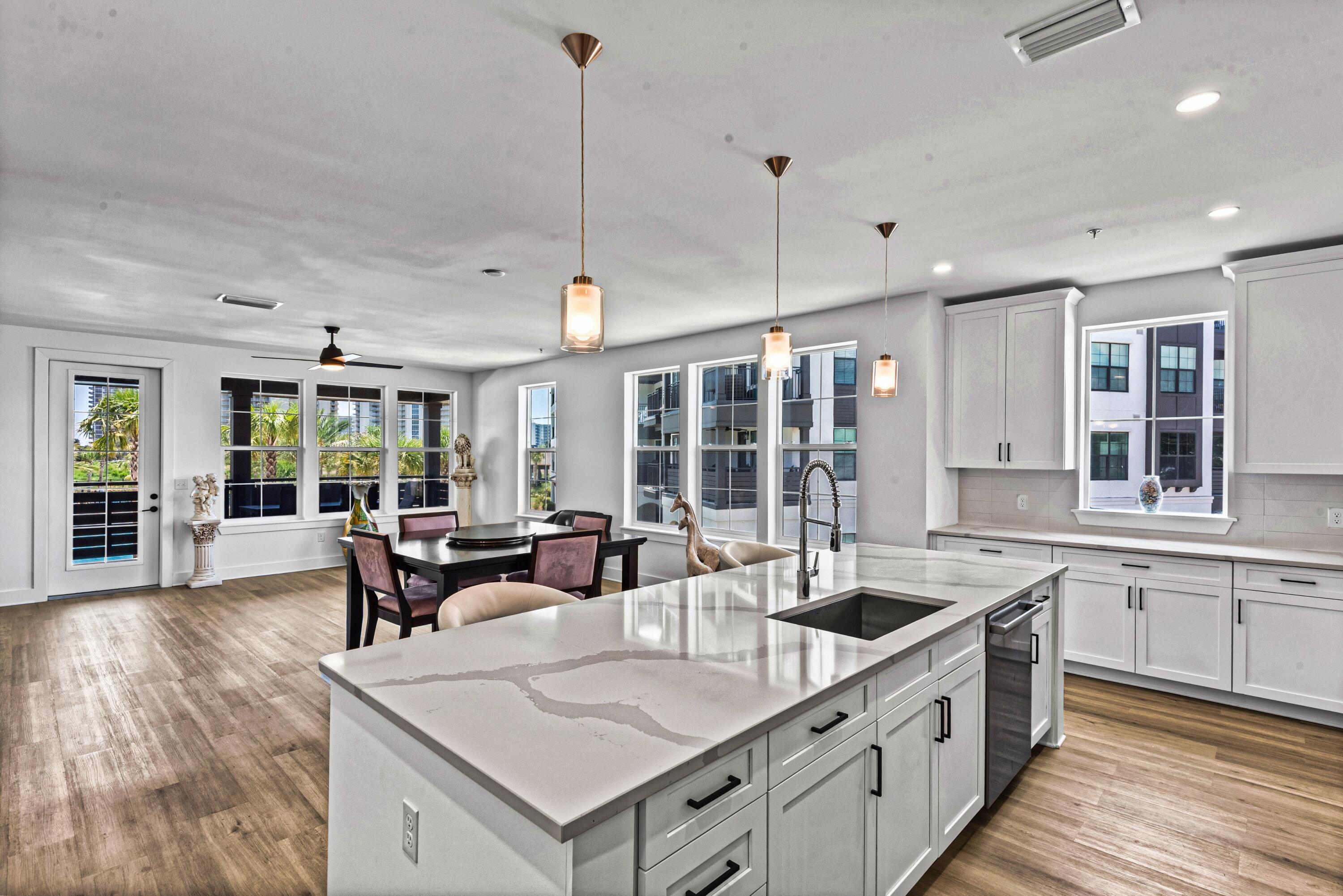 A rare opportunity to own a three-bedroom currently offered for sale at The Grove at Seascape Resort with a perfect center pool view! This beautifully maintained second-floor condominium offers three bedrooms, four baths and approximately 1,955 square feet of refined interior living space, plus a spacious private veranda perfectly positioned to overlook the resort's spectacular Aquatic Garden Oasis.

Never rented and maintained in exceptional condition, the residence provides the feel of a nearly new luxury property without the wear commonly associated with vacation rentals. The open living, dining and kitchen areas are framed by expansive glass and direct, centered views of the pools and winding lazy river. Step onto the veranda and enjoy a true outdoor living space with one of the most desirable water views in The Grove.

Limited corner/end unit with upscale finishes include white quartz countertops and backsplash, soft-close shaker cabinetry, Bosch stainless-steel appliances with a gas range, recessed lighting, luxury vinyl plank and porcelain tile flooring, generous walk-in closets and a spa-inspired primary bath with soaking tub. High ceilings and a thoughtfully designed floor plan create an open, comfortable setting for entertaining and extended stays.

Conveniently positioned near the stair access, the second-floor location allows owners and guests to come and go quickly without relying on the elevators. The condominium is vacant and available for easy showing. Estimated gross annual rental income of approximately $80,000-$95,000 based on comparable vacation rentals. Buyers should verify rental income potential with their preferred vacation rental management company.

Located within the 300-acre Seascape Resort, The Grove places owners and guests near 2,000 feet of private beach, resort pools, golf, tennis, restaurants, live entertainment, water sports and The Whale's Tail Beach Bar & Grill. Enjoy the residence as a luxurious second home or vacation retreat, place it in a short-term rental program, or combine personal enjoyment with rental-income potential.

With its exceptional condition, spacious three-bedroom layout, four baths and premier pool-facing position, this is a distinctive opportunity within one of Miramar Beach's newest resort communities.

Amenities, association fees, rental restrictions and access to Seascape Resort facilities are subject to association/resort rules and availability. Buyer to independently verify these and any other information deemed important.