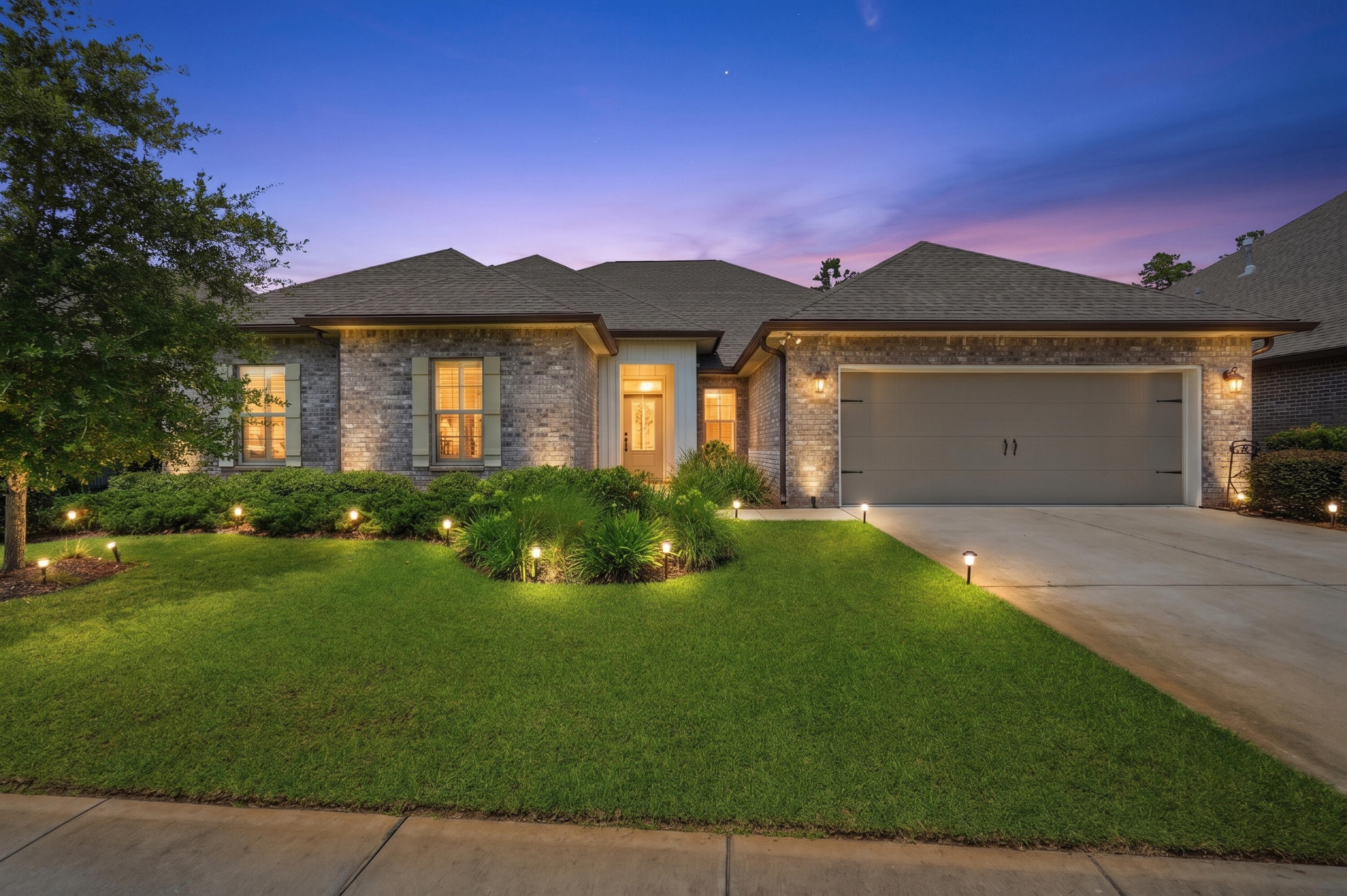 Welcome to 165 Blaze Boulevard, an exceptional home in The Trails at Hammock Bay, one of Northwest Florida's premier master-planned communities. Offering over 3,250 square feet, this beautifully designed 5-bedroom, 3-bath residence combines timeless style with everyday comfort. The open-concept floor plan showcases luxury wood-look tile flooring, quartz countertops, upgraded white cabinetry, crown molding, plantation shutters, recessed lighting, and a cozy gas fireplace. The first-floor primary suite offers a spa-inspired bath with dual vanities, soaking tub, separate shower, and a spacious walk-in closet with direct access to the laundry room. Upstairs, you'll find a private guest suite, full bath, and versatile bonus room--ideal for a media room, home office, or multi-generational living. Relax year-round on the screened lanai overlooking the landscaped backyard. 

Enjoy the unmatched Hammock Bay lifestyle with resort-style pools, a clubhouse and fitness center, tennis, pickleball and basketball courts, miles of scenic walking and biking trails, parks, playgrounds, dog parks, a fishing lake, movie theater, The General Store, and year-round community events. Conveniently located just minutes from the white-sand beaches of 30A, Destin, and Panama City Beach, this home offers an exceptional blend of luxury, convenience, and coastal living.