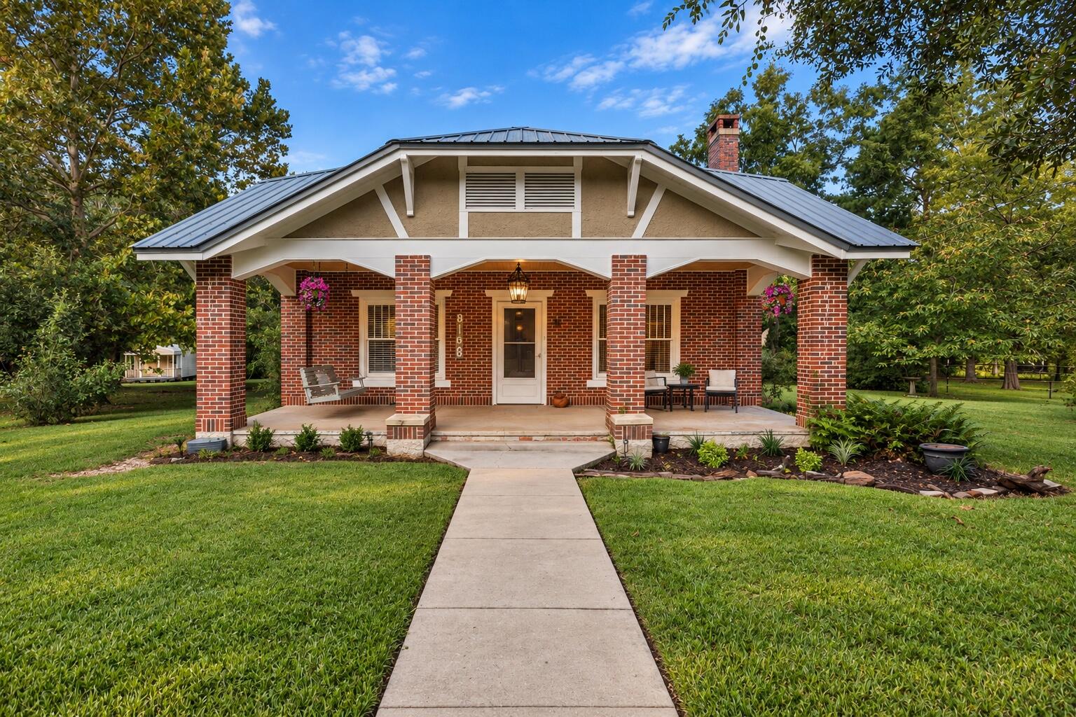 Charm and character with room for all your animals! This updated gem sits on almost five acres in the heart of downtown Laurel Hill, just a minute from the school. Move-in ready with tall ceilings, a cozy gas fireplace, and beautifully updated kitchen and baths.
The freshly painted interior is light and bright, with the kitchen opened to the eat-in dining area. New ceramic tile runs through the kitchen and walk-in pantry, while butcher block counters, a farmhouse sink, copper backsplash, and updated cabinets create a warm, welcoming feel. Original hardwood floors have been professionally refinished for vintage character with a like-new finish.
A bonus Florida room offers flexible space for an office, playroom, or guest area, plus an indoor laundry room adds everyday convenience. Major systems are covered: brand-new HVAC (Jan. 2025), a new water heater, and a metal roof.
Outside, classic brick and a welcoming front porch set the tone, while the covered back porch, complete with a sink, is ready for your outdoor kitchen. The mature yard features established trees and bushes, with deer wandering through daily. A shed provides extra storage, and a detached carport offers covered parking. Partially fenced and cross-fenced, it's ready for horses or other animals.
This listing includes an adjoining parcel for nearly five total acres -- a rare blend of small-town convenience and wide-open country living, all within walking distance to downtown.