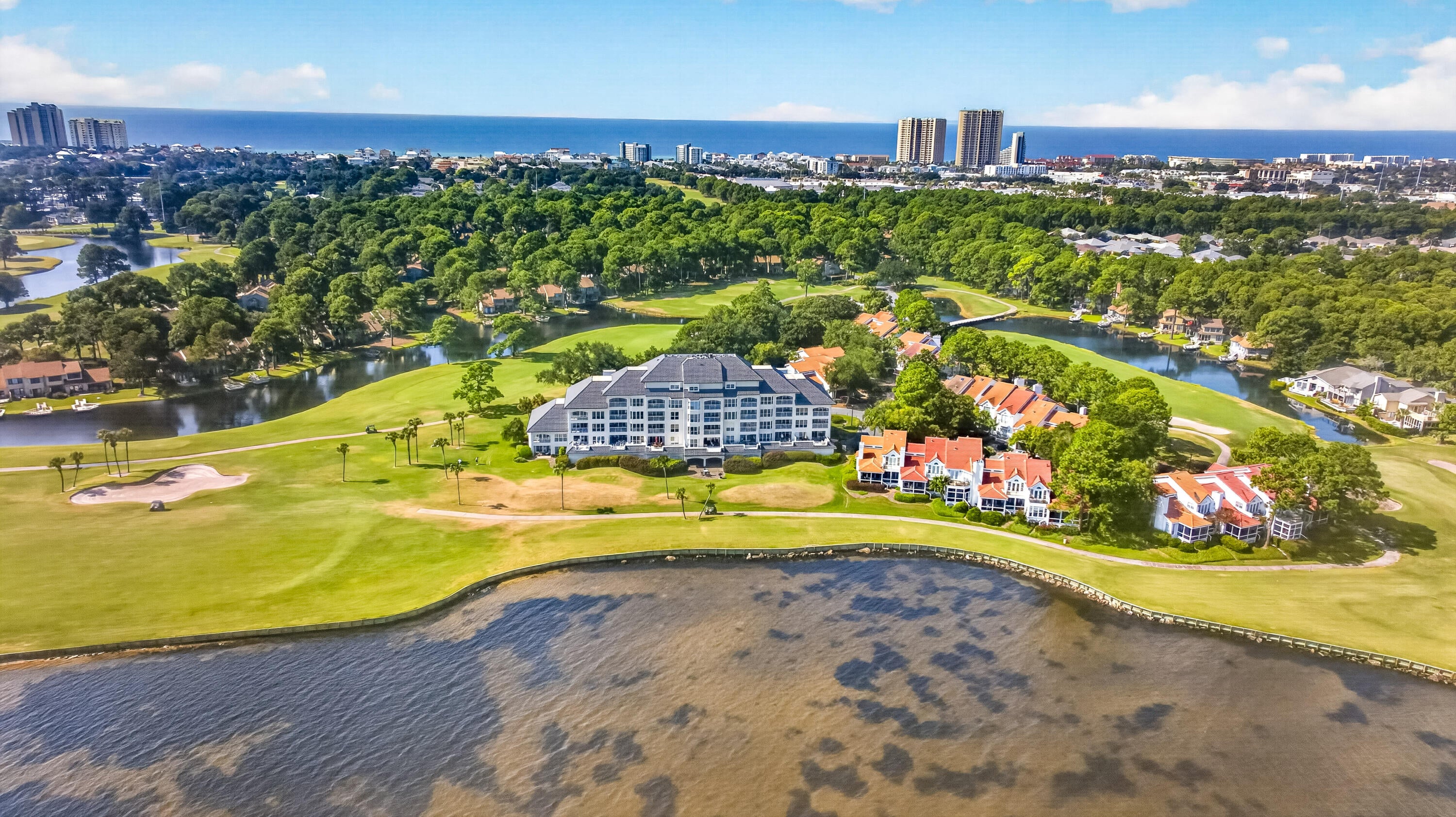 PENTHOUSE LIVING!!! Experience elevated bayfront living from this exceptional 3-bedroom, 3.5-bath penthouse residence in Players Club on the Bay, an intimate community of just 28 residences within Sandestin Golf & Beach Resort. Offering 2,213 square feet of beautifully designed living space, this fifth-floor retreat showcases sweeping views of the Choctawhatchee Bay and the 9th fairway of the Linkside Golf Course from nearly every room. Step onto the private balcony and enjoy a front-row seat to the natural beauty of the Bay-from peaceful mornings and colorful sunsets to passing boats, coastal birds, and the occasional dolphin. Inside, soaring ceilings and abundant natural light create an open, airy atmosphere, complemented by luxury vinyl plank flooring and custom window treatments. As one of only three 3-bedroom residences in Players Club, this penthouse offers a rare combination of space, privacy, and spectacular views. The main level primary suite provides a relaxing owner's retreat with a spa-inspired bath featuring marble countertops, dual vanities, a walk-in shower, and generous storage. Upstairs, two additional bedrooms each feature an ensuite bath along with beautiful views overlooking the Bay and golf course. Thoughtful updates enhance the home's move-in-ready appeal, including new flooring in 2024, HVAC replaced in 2023, fresh interior paint, stainless steel appliances, and updated furnishings. Players Club on the Bay is exceptionally well maintained and offers desirable convenience including a covered parking space, dedicated golf cart parking, ground-level storage, a private community pool, and a spacious communal patio ideal for gathering with friends and neighbors. Significant building improvements include a new elevator installed in 2022, a steel metal tile roof completed in 2023 and rated for Category 5 winds, and extensive waterproofing improvements completed in 2024. The Florida Structural Integrity Reserve Study and Milestone Inspection have also been completed.

Tucked away in a peaceful bayfront setting yet convenient to everything Sandestin has to offer, this remarkable penthouse places championship golf, dining, shopping, entertainment, and the sugar-white beaches of the Emerald Coast within easy reach. Rarely available and beautifully positioned, this is a special opportunity to enjoy the very best of the Sandestin lifestyle.

As an introduction to the Sandestin lifestyle, we invite our new owners to explore amenities that make Sandestin special. The listing brokerage and seller(s) are presenting the buyer(s) of this property with (2) 90-minute rounds of Tennis court time, a golf foursome at one of our three championship courses, and a round of golf for up to four (4) players at the unrivaled Burnt Pine Golf Club. Sandestin Golf and Beach Resort features more than seven miles of beaches and pristine bay front, four championship golf courses, 15 world-class tennis courts, a 226-slip marina, a fitness center, spa and celebrity chef dining. Shop, dine and play at the charming pedestrian village, The Village of Baytowne Wharf and more. Inside the gates of the resort, residents enjoy a balanced lifestyle of high-class living, spanning the 2,400 acres from the beach to the bay. Everything within the gates of the resort is accessible by golf cart or bicycle. The entire resort is interconnected by miles of pedestrian, bike and golf cart paths that weave through groves of live oaks, meandering past natural lagoons, fountains, man-made lakes, and meticulously landscaped fairways.
