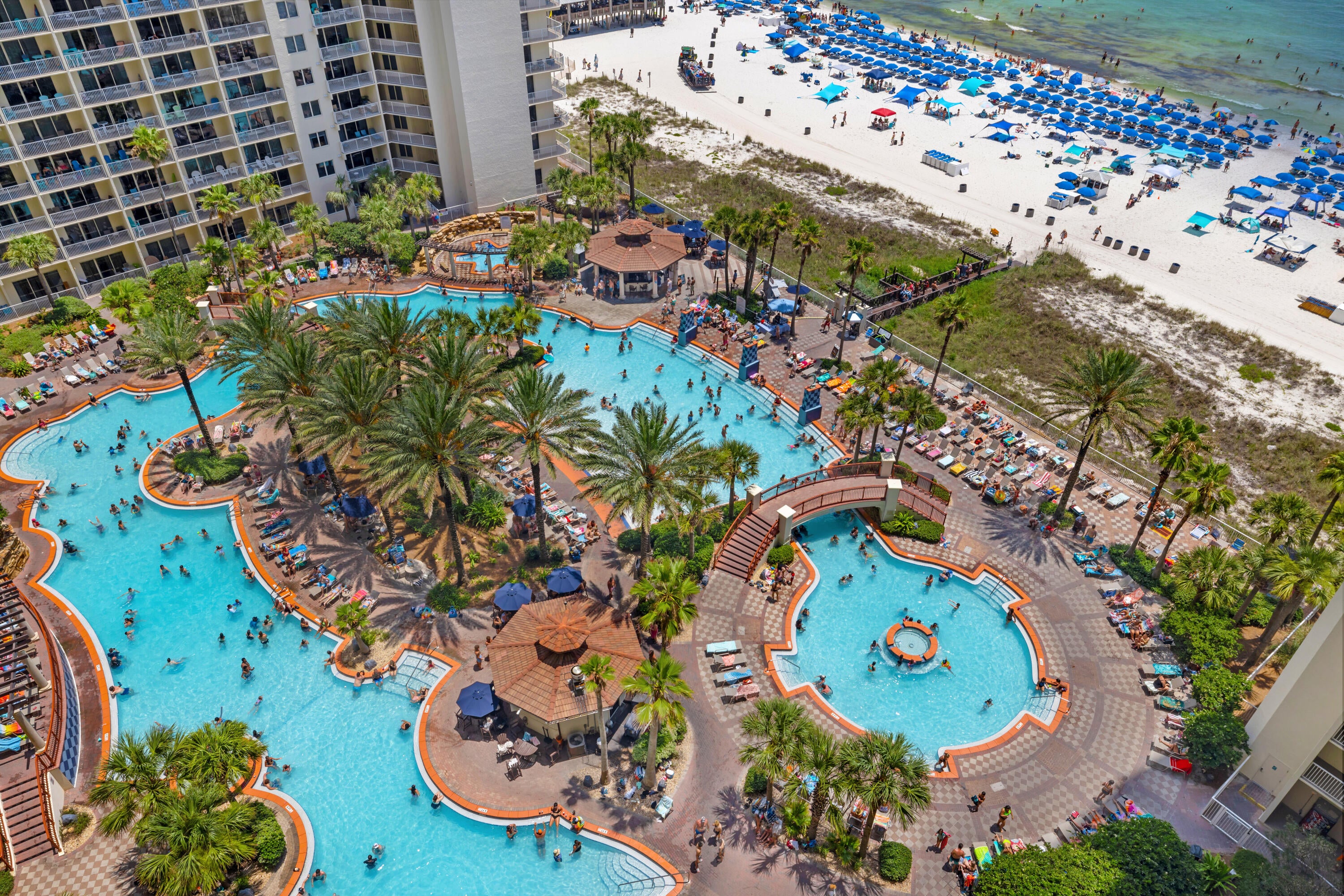 RARE TYPE F FLOOR PLAN. DEEDED PARKING. FRONT DOOR RIGHT BY THE ELEVATOR.

Shores of Panama 1410 is a rare Type F floor plan in Panama City Beach, offering deeded parking, a front-door location right by the elevator, and a furnished setup ready for continued rental use. This one-bedroom plus bunk layout includes a cozy living area with a flat-screen TV, dining area, luxury vinyl plank flooring through the main living spaces, and tile flooring in the kitchen and bathrooms.

The kitchen features granite countertops, two refrigerators, and a front-load stackable washer and dryer. Near the entry, a spacious bunk area is positioned along the hallway with a convenient half bathroom nearby. The primary suite includes a king-size bed and a private full bathroom.
The balcony is furnished with Polywood high-top table and chairs, creating a comfortable outdoor setup overlooking the resort setting. Additional details include a deeded parking space on the 7th floor, water heater from 2016, and HVAC from 2018.

Shores of Panama Resort features one of the largest Gulf-front lagoon-style pools in Panama City Beach. The zero-entry tropical pool includes palm-lined islands, fountains, and a spacious hot tub along the resort's private beachfront access. Additional amenities include an indoor heated pool and hot tub, a 24-hour fitness center, and a seasonal poolside Tiki bar. Located in the heart of Panama City Beach, Shores of Panama places dining, shopping, and entertainment nearby. Pineapple Willy's is adjacent to the resort, while Laketown Wharf directly across the street offers dining, retail, and entertainment options including Wharf Seafood Buffet, The Candymaker Ice Cream Shop, PCB Pizza, In Cahoots, The Press, The Bun Lab, 810 Billiards & Bowling, salon services, and more. Panama City Beach has also welcomed newer attractions and entertainment venues including Dolly Parton's Pirates Voyage Dinner & Show, Topgolf, McGuire's Irish Pub, and Tootsie's Orchid Lounge.

The same owner is also selling unit 1408 (MLS 792192), positioned nearby on the same floor. For guests traveling together, the close front-door proximity creates a convenient two-unit setup with the same elevator access, separate private spaces, and more time together without being spread across the resort.

HOA dues are $3,507.11 per quarter. One special assessment payment remains in the amount of $1,218.04 (4th quarter of 2026) Approximate Gross rental income was $25,000 in 2024, $20,000 in 2025 when the balcony was closed for repairs, and $22,400 year-to-date through the end of June 2026. 

All information, rental income, HOA fees, assessments, measurements, and property details are deemed reliable but not guaranteed; buyer to verify if important.