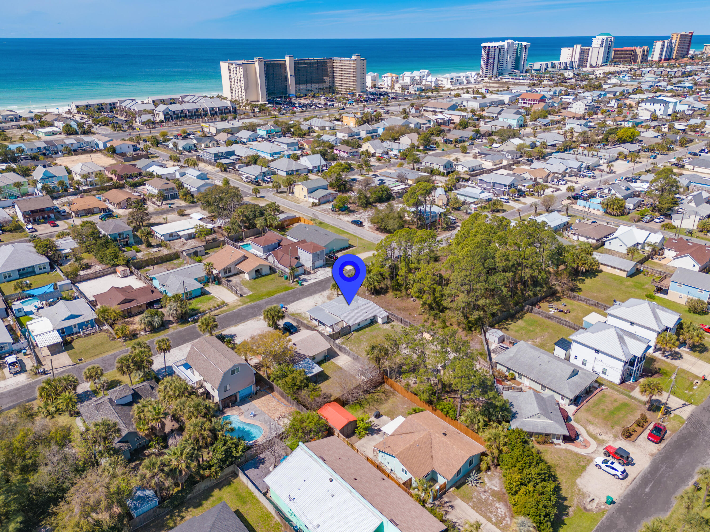 Fully renovated beach cottage and RENTAL MACHINE only .3 miles from the Gulf! This stunning 3-bedroom, 2-bath coastal home sits on a huge lot with no HOA in the heart of Lower Grand Lagoon, offering the kind of space that is nearly impossible to find this close to the water. Every inch of this cottage has been meticulously updated, including a 2020 metal roof, HVAC, Hardie Board siding, vinyl windows, septic system, PEX plumbing, and copper wiring. The coastal interior shines with granite countertops, white cabinets, stainless appliances, wood-look tile flooring, and updated fixtures throughout. All of the furnishings convey to the new buyer. 

Beyond the beautiful renovations, this property is a proven high-producing investment that has consistently delivered impressive results, generating $58,642 in 2023, $50,378 in 2024, and $45,591 in 2025. It is currently self-managed and the seller would be happy to share his process and vendors so a new buyer could continue. 2026 is on track with HUGE numbers! Over $41,500 already completed in Jan-July 2026! 

The massive yard provides plenty of room to add a private pool, while the oversized driveway offers an abundance of parking for a boat, jet skis, and golf cart. An amazing covered front porch offers the perfect hangout, while the private outdoor shower makes cleaning off the sand effortless after a day at the beach.  This prime location puts you mere blocks from the community boat ramp and minutes from the area's best-loved dining spots like Schooners, Patches, and Finn's, offering guests the ultimate coastal lifestyle with world-class boating, fishing, and white sandy beaches just down the street. This property perfectly balances a relaxed coastal vibe with a proven track record of rental success. Schedule your showing today. A video tour is also available