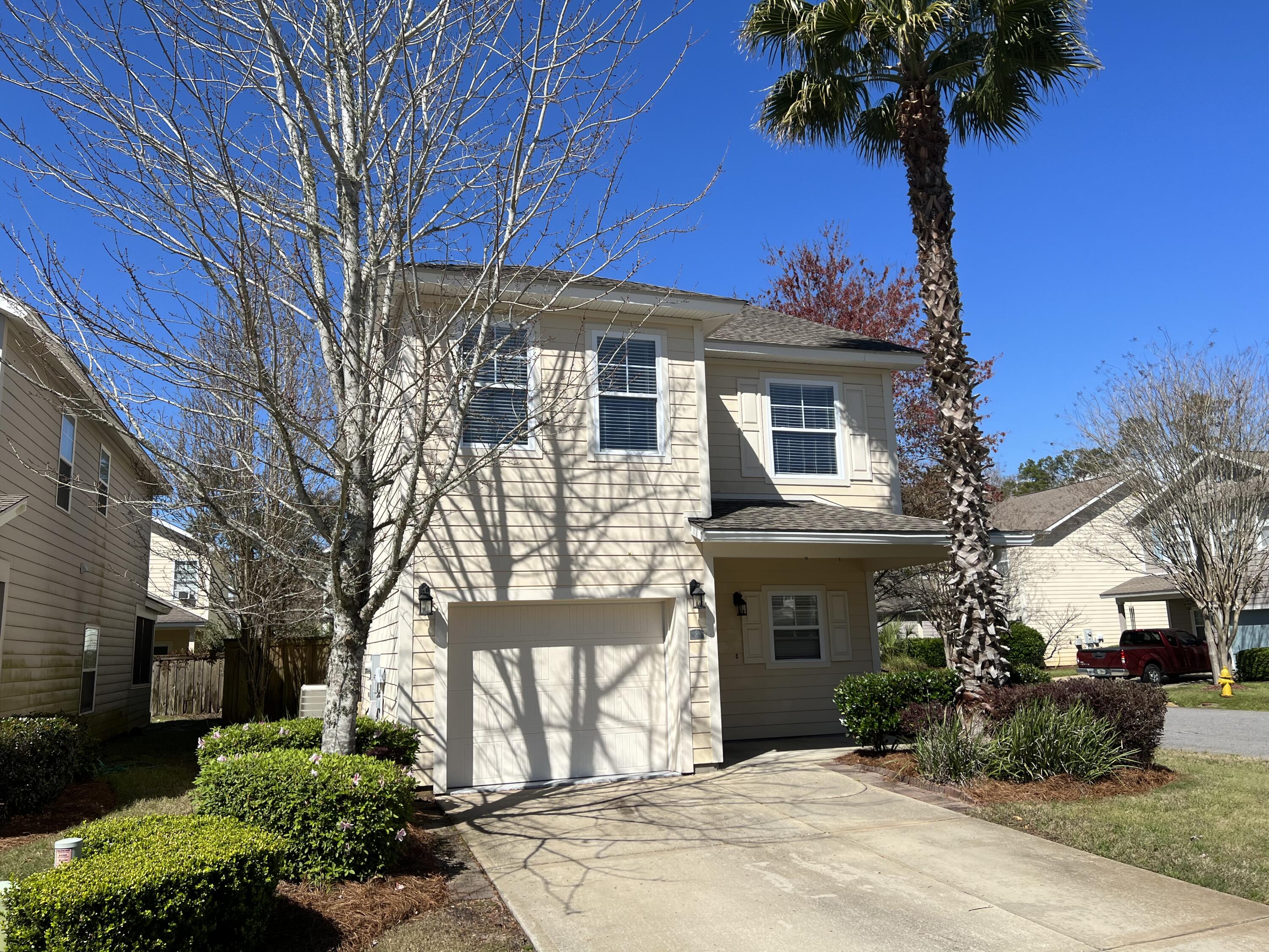 Discover a beautifully designed corner home in Santa Rosa Beach with stainless steel appliances and stylish kitchen cabinets. Enjoy spacious living and dining areas with tile flooring and plush carpeting in the bedrooms. The functional layout features a main-level bedroom with a full bathroom, while the master bedroom boasts a pitched ceiling, walk-in closet, and a master bath with soaking tub and separate shower. Two additional bedrooms share a third full bathroom. A large laundry room adds convenience, and outdoor living is enhanced by a back porch, outdoor paver patio, and fenced backyard. Located in a tranquil cul-de-sac, this end unit offers a peaceful atmosphere. Schedule your visit today!