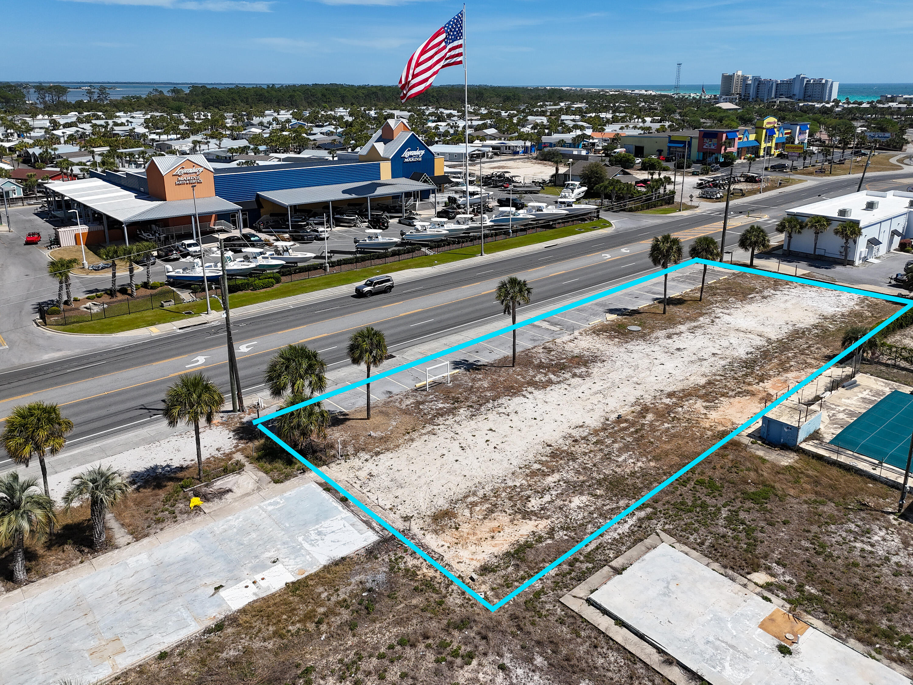 The site features 225 feet of frontage and is zoned C-3, which allows for outside storage and most commercial uses. The property is high and dry, with all utilities already available on-site, including a grinder station. This location offers excellent visibility and traffic, with nearly 20,000 cars passing by daily. Additionally, it is situated across from two large marinas and in close proximity to St. Andrews State Park. Please let me know if you would like more information or are interested in discussing this opportunity further. OWNER FINANCING AVAILABLE