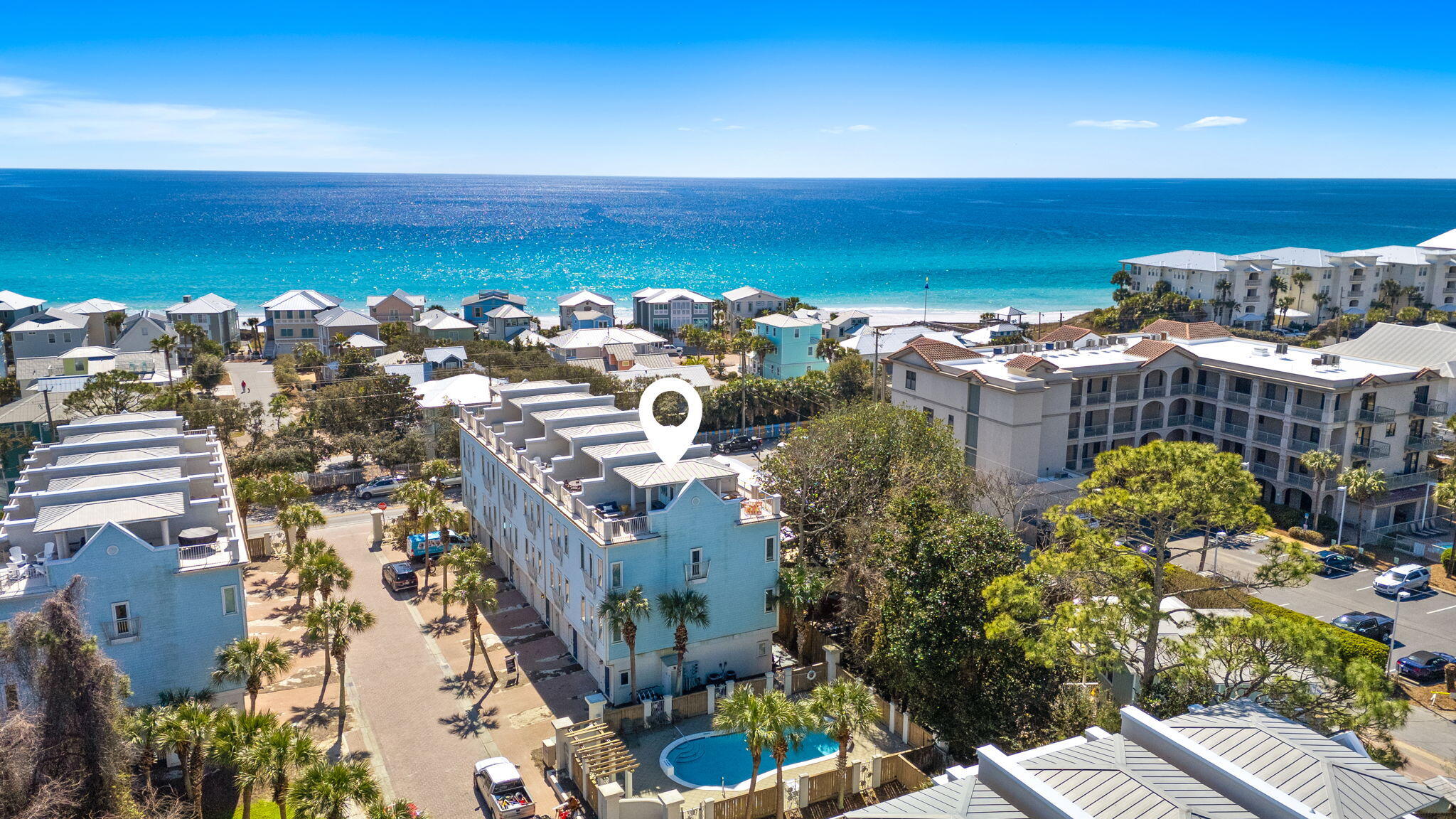 Own a Beach House Home That Pays For Itself with easy beach access RIGHT ACROSS THE STREET!  Get your $76,000+ first-year federal tax savings through cost segregation and 100% bonus depreciation at asking price(permanently restored 2025)*. Positioned in the heart of Gulf Place along Scenic Highway 30A, 27 Summer Place Lane captures the rhythm of coastal living with gulf views, exceptional walkability, and proven rental performance. Just steps from the deeded Ed Walline and Shell Seekers Cove beach accesses and an easy stroll to Shunk Gulley, Papa Surf Burger Bar, and the Gulf Place town center, this fully renovated end-unit townhome places everything that makes 30A iconic right outside your door. Spanning four thoughtfully designed levels, the residence offers four bedrooms and four full baths with a layout that consistently performs as a short-term rental. In 2025 alone, the owner only opened the calendar for 65% of the year, the property generated nearly $83,000 in gross rental income, as the owners reserved significant time for personal enjoyment. A rare ground-floor lock-off suite with private entrance, kitchenette, and full bath provides flexibility for independent off-season rentals or private guest quarters. The main living level showcases an updated open kitchen with quartz countertops, a generous island, and KitchenAid stainless steel appliances, seamlessly flowing into inviting dining and living spaces designed for gathering after long beach days. A custom bunk room featuring two twin beds over a king sits on this level, paired with a full bath and walk-in shower, an ideal configuration for families and group stays. Upstairs, two king suites with private ensuite baths offer well-separated sleeping accommodations, creating comfort and privacy for both owners and guests. At the top, a private rooftop terrace serves as one of the home's most requested features, offering covered and open-air seating with captivating gulf views and coastal breezes. As the only unit with two dedicated parking spaces and immediate access to the seasonally heated community pool, the home stands apart within Summer Place. Offered fully furnished and turnkey, including five bicycles, it is ready for immediate enjoyment or continued income production. With an acceptable offer, the seller is also providing one year of HOA dues paid at closing, adding further value to this exceptional 30A opportunity. Contact your tax professional for full depreciation and how it applies to you.*