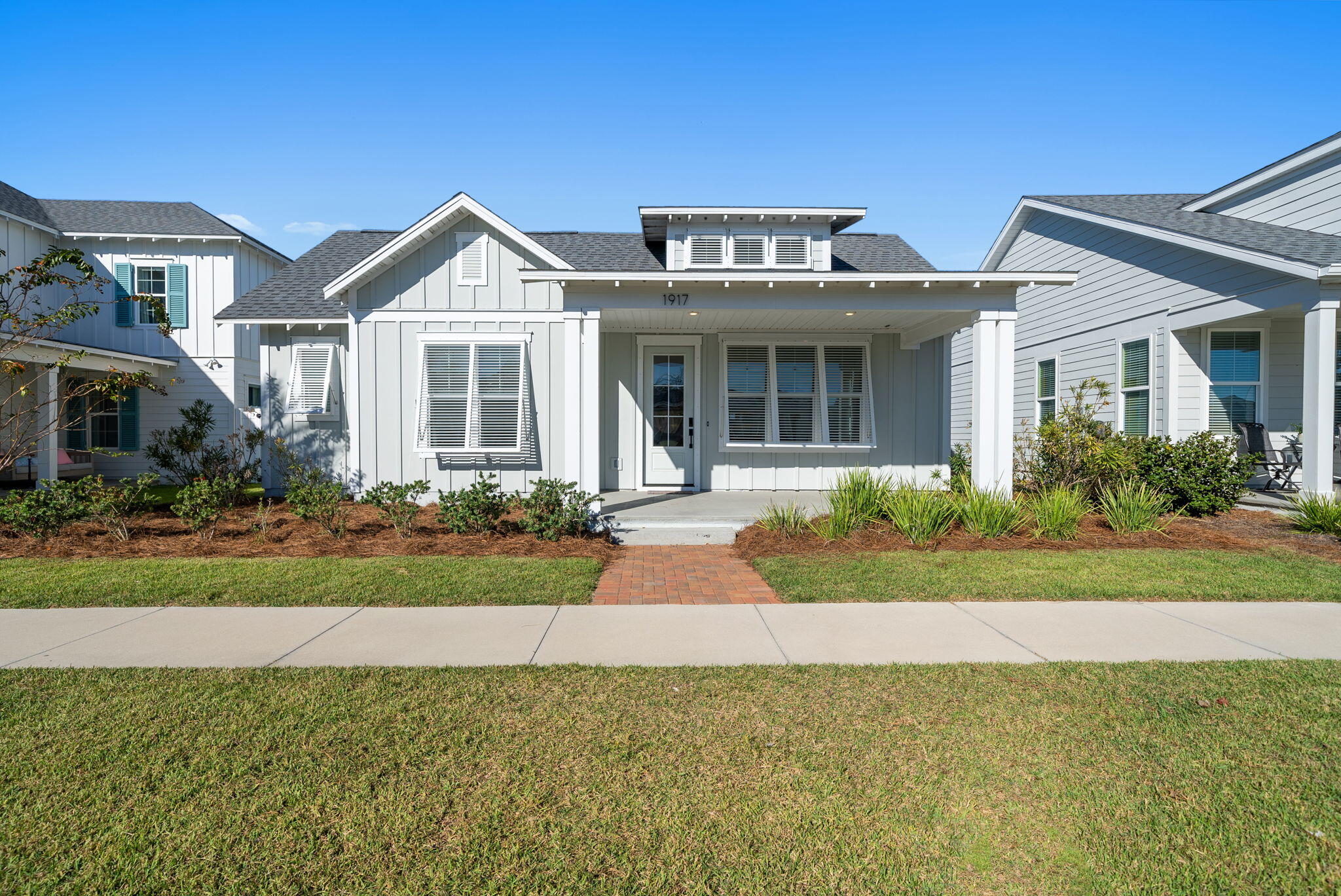 Experience Luxury Living in SweetBay! Welcome to this stunning St. Andrews floor plan—one of SweetBay's most popular designs—offering 4 bedrooms, 3 baths, and an attached garage in a prime location directly across from the resort-style pool! Step onto the inviting covered front porch, complete with bahama shutters and into a bright, open foyer that flows seamlessly into the elegant dining area. The gourmet kitchen is a chef's dream, featuring quartz countertops, stainless steel appliances, a spacious center island, and abundant cabinetry. The open-concept design connects the kitchen to the comfortable family room, creating the perfect setting for entertaining or relaxing with family. Retreat to the serene master suite, complete with a tray ceiling, walk-in closet, dual vanities, and a luxurious oversized shower. Outside, enjoy a private backyard oasis with a covered porch, astroturf and vinyl privacy fenceideal for outdoor dining, play, or quiet evenings under the stars. Living in SweetBay means more than just owning a homeit's embracing a lifestyle. Residents enjoy access to two resort-style pools, scenic parks, a basketball court, amphitheater, and miles of walking and biking trails. Spend your weekends paddleboarding or kayaking on North Bay, and look forward to the exciting future addition of a town center and marina with wet and dry boat storage. This beautiful home is move-in ready and perfectly positioned to enjoy everything SweetBay has to offer. Schedule your private tour today and start living the lifestyle you deserve!