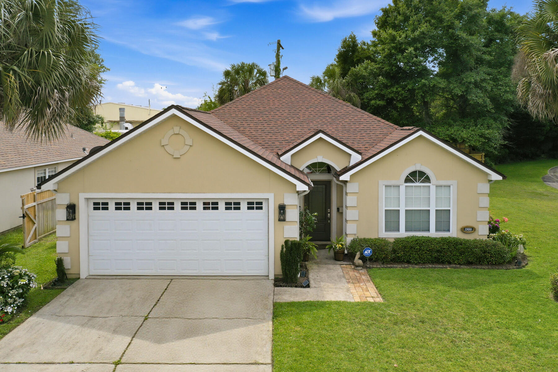 Welcome home to this spacious 3-bedroom, 2-bath retreat perfectly situated on a corner lot in one of Fort Walton Beach's most convenient locations. From the moment you arrive, you'll appreciate the pride of ownership and exceptional care this home has received over the years. Inside, you'll find a thoughtfully designed floor plan featuring an inviting living room with a cozy fireplace, tray ceiling, built-in surround sound speakers, crown molding, and plenty of space for gathering with family and friends. Fresh interior paint gives the home a bright, move-in-ready feel. The kitchen offers abundant cabinet and countertop space, a center island, and easy flow into the main living areas. Just off the living space is a versatile bonus room featuring beautiful natural light that can be used as a home office, playroom, formal dining area, homeschool space, gym, or potential fourth bedroom. The spacious primary suite serves as a relaxing haven with tray ceilings, generous room sizes, and views of the backyard. You'll also love the oversized laundry room complete with built-in cabinetry and folding space for added convenience. Step outside to enjoy the fully fenced backyard, perfect for pets, children, entertaining, or simply relaxing in your own private outdoor space. Located just minutes from shopping, restaurants, schools, and everyday conveniences including Walmart, Lowe's, and Kohl's. Plus, you're 5 miles from the beautiful Emerald Coast beaches approximately 10 minutes to Eglin Air Force Base, and about 15-20 minutes to Hurlburt Field. This is the kind of home buyers wait for clean, spacious, well-maintained, and in an unbeatable location. Roof is approximately 3 years old. Water heater will be replaced prior to closing. Schedule your private showing today!