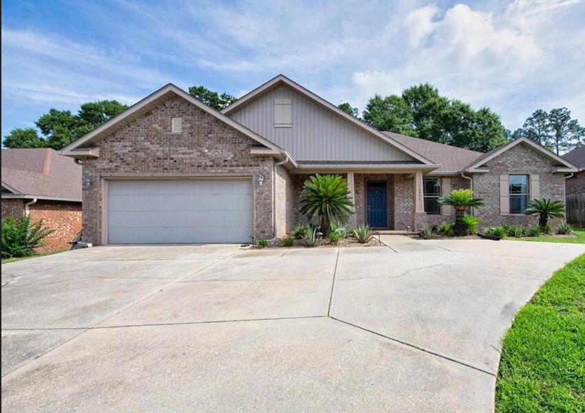 Seller offering 10K seller concession.  This beautifully maintained 4-bedroom, 3-full-bath brick home offers over 2,300 square feet of thoughtfully designed living space, plus a versatile bonus room perfect for a home office, playroom, media room, or guest retreat. Featuring a desirable open-concept layout and split-bedroom floor plan, this home provides the perfect balance of spacious gathering areas and private living spaces. Designed with accessibility in mind, the home has been customized for handicap and wheelchair accessibility, providing comfort and convenience throughout. Step inside to discover elegant Calacatta tile flooring in the main living and dining areas, soaring ceilings, and a bright, open living space ideal for both everyday living and entertaining. The spacious kitchen is a chef's delight, featuring all-new appliances, a built-in microwave, abundant cabinetry, and a large walk-in pantry. Overlooking the main living area, the kitchen creates a seamless flow for entertaining and family gatherings. A formal dining room offers the perfect setting for holidays and special occasions. The generous primary suite is thoughtfully separated from the secondary bedrooms, creating a private retreat. The well-appointed guest bedrooms provide plenty of space for family and visitors. One of the bathrooms offers direct access to the covered back porch, enhancing the home's accessibility and outdoor functionality. Outside, enjoy a large backyard complete with a privacy fence, creating a perfect space for relaxation, pets, play, or entertaining. The current owner has invested countless hours into enhancing the landscaping, adding beautiful palm trees, aloe plants, and meticulously maintaining a lush, green lawn that adds to the home's curb appeal and outdoor enjoyment. Conveniently located within close proximity to interstate access, this move-in-ready home combines style, functionality, and accessibility in one exceptional package, Roof 2013,  High -Efficiency two stage HVAC 2024, water Heater 2013