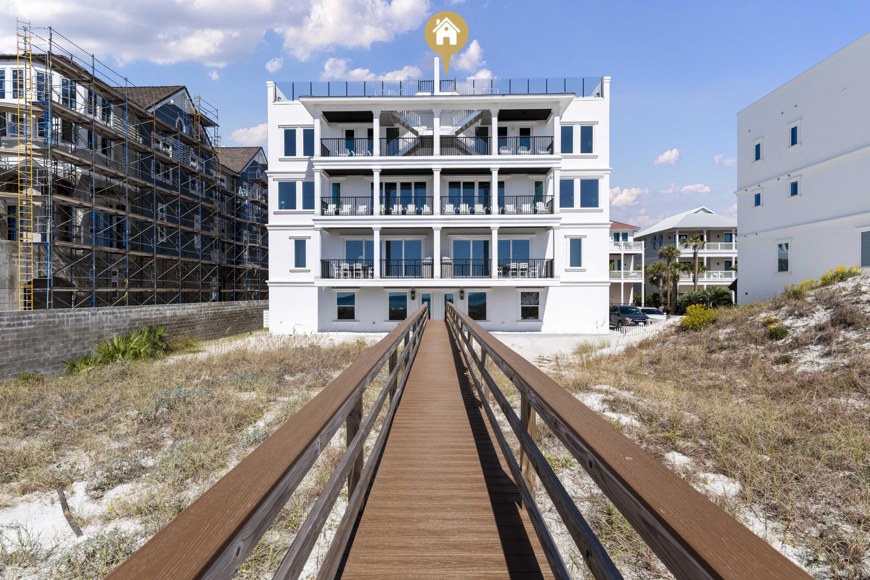 Unique Financing Opportunity! Seller is offering owner financing at 4.5% interest with no origination fees, a 30-year amortization, and a 5-year balloon. An exceptional Gulf-front residence that defines elevated coastal luxury, perfectly positioned along the pristine shores of 30A. Encompassing 4,216 sq ft with 4 Gulf-front bedrooms, this remarkable property sits on nearly an acre with 109 feet of direct Gulf frontage & private access via a shared dune walkover with Unit A. Designed to capture uninterrupted views of the emerald waters, the home offers multiple outdoor living spaces, including three Gulf-front balconies & a stunning rooftop terrace with a private pool overlooking the coastline. Thoughtfully designed by Eric Craig of B. Design, the residence showcases impeccable craftsmanship, clean architectural lines, and a seamless, flowing layout. Interiors are enhanced by soaring 9-10ft ceilings, wood-look porcelain tile, custom mosaic details, whitewashed spruce ceilings, and predominantly Kohler fixtures, all complemented by curated lighting and refined finishes throughout. Engineered for both durability and efficiency, the home features ICF construction, impact-rated glass, superior insulation, four high-efficiency HVAC systems with built-in dehumidifiers, a tankless gas water system, central vacuum, security system, and full smart home integration for effortless remote control.

The main living level is designed for both relaxed living and elegant entertaining, featuring a Gulf-front great room with expansive windows, a covered balcony, and a chef's kitchen appointed with Sub-Zero refrigeration, a Wolf dual-fuel range with 8-burner gas cooktop, wine cooler, custom cabinetry, and designer backsplash. Architectural details such as coffered ceilings and tongue-and-groove accents further elevate the space.

Spanning four levels, the home offers multiple living areas and beautifully appointed bedroom suites, all Gulf-front, each designed to maximize views and privacy. The third level features two Gulf-front suites with balcony access and an additional living area, while the top-floor primary suite serves as a private retreat with sweeping Gulf views and a spa-inspired bath complete with a freestanding tub and walk-in shower. A first-floor game room with kitchenette and full bath provides a perfect transition from beach to home, ideal for entertaining.

The rooftop level is a true showpiece, featuring a private pool, expansive paver deck for sunning, and sleek glass railings that frame unobstructed panoramic Gulf views. An elevator services all four levels for added convenience, and the property includes a 1-car garage with additional parking in the drive.

Offered fully furnished and professionally designed, this turnkey residence presents an exceptional opportunity as a primary home, second residence, or a high-performing investment. With proven rental income of $282K in 2025, the property offers immediate revenue potential alongside long-term appreciation.

Ideally located in the heart of Seagrove Beach, this exclusive setting features a private, palm-lined street shared by only 3 other Gulf-front homes. Enjoy close proximity to Seaside, Alys Beach, and Rosemary Beach, along with local favorites such as Old Florida Fish House, Buddy's Seafood Market, Beachy Bean Coffee, and Coastside 30A. Outdoor enthusiasts will appreciate nearby Eastern Lake, one of the area's rare coastal dune lakes, as well as Deer Lake State Park, scenic nature trails, and the Timpoochee Trail for biking and exploration. A rare opportunity to own a truly distinctive Gulf-front property in one of 30A's most coveted locations.