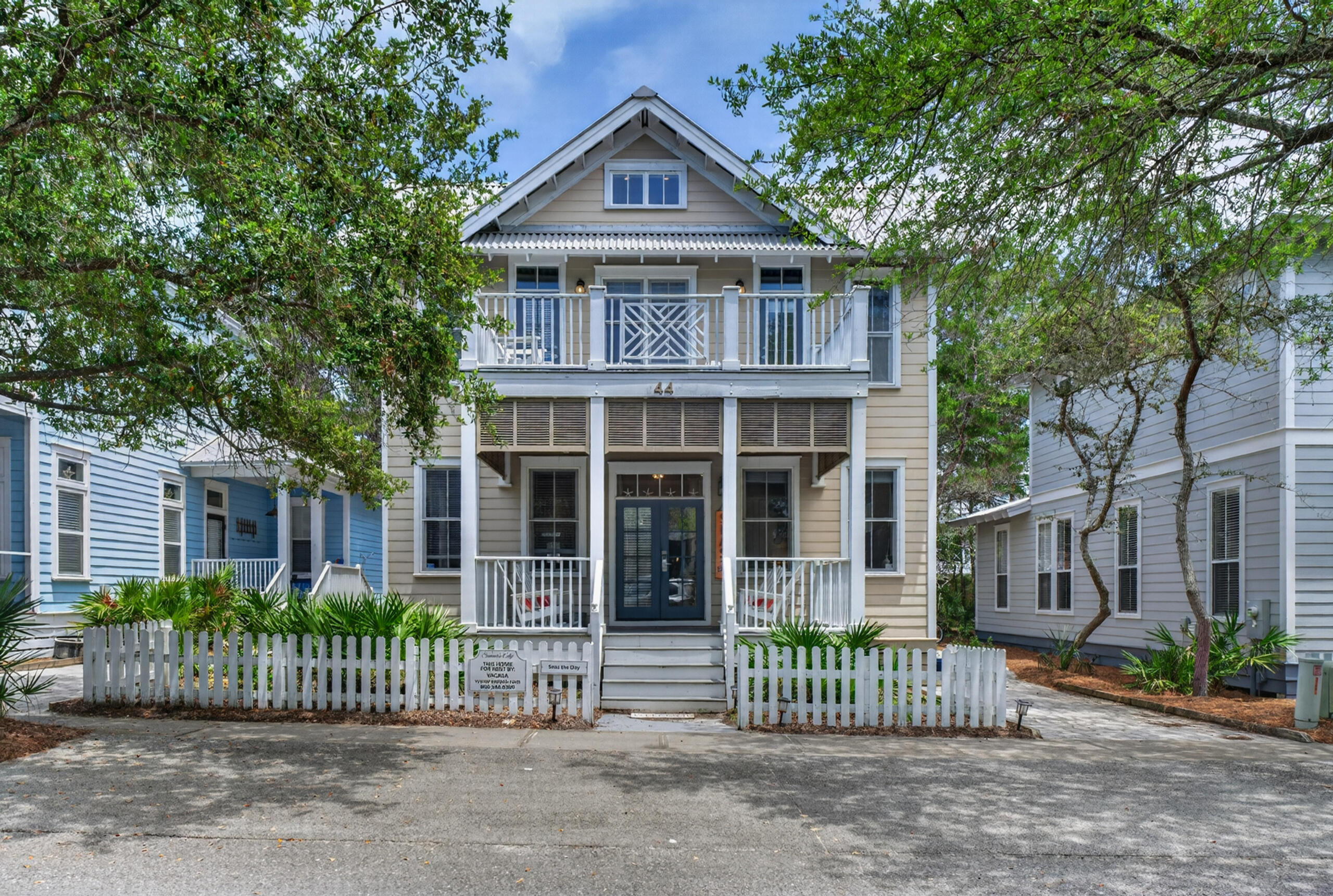 Enjoy coastal living in this turn-key 3-bedroom, 2.5-bath cottage located in the quiet, tree-lined community of Summer's Edge on Scenic 30A. Situated moments from deeded beach access, Eastern Lake, and community pool, this property offers an ideal layout for a personal coastal retreat or vacation rental investment.
The welcoming front porch features upgraded Trex composite decking, matched by a private second-floor balcony off the primary suite. Inside, the open floor plan highlights real hardwood flooring, detailed crown molding, recessed lighting, and expansive windows. The main living area features custom built-in shelving, leading to a kitchen with stainless steel appliances, generous counter space, and a dedicated dining area. Upstairs, the primary suite includes soaring cathedral ceilings, a skylight, private balcony access, and a updated spa-style bathroom with a double vanity, freestanding soaking tub, and a custom tile shower. Two additional guest bedrooms offer comfortable accommodations with coastal finishes throughout. Residents and guests enjoy private deeded beach access, two neighborhood pools (one heated seasonally), and immediate proximity to the dining and shopping along 30A. floor-to-ceiling tiled shower. Guest bathrooms have also been tastefully updated with premium finishes.  A rare opportunity to own a turnkey beach cottage in one of 30A's most desirable communities--where every day feels like vacation.