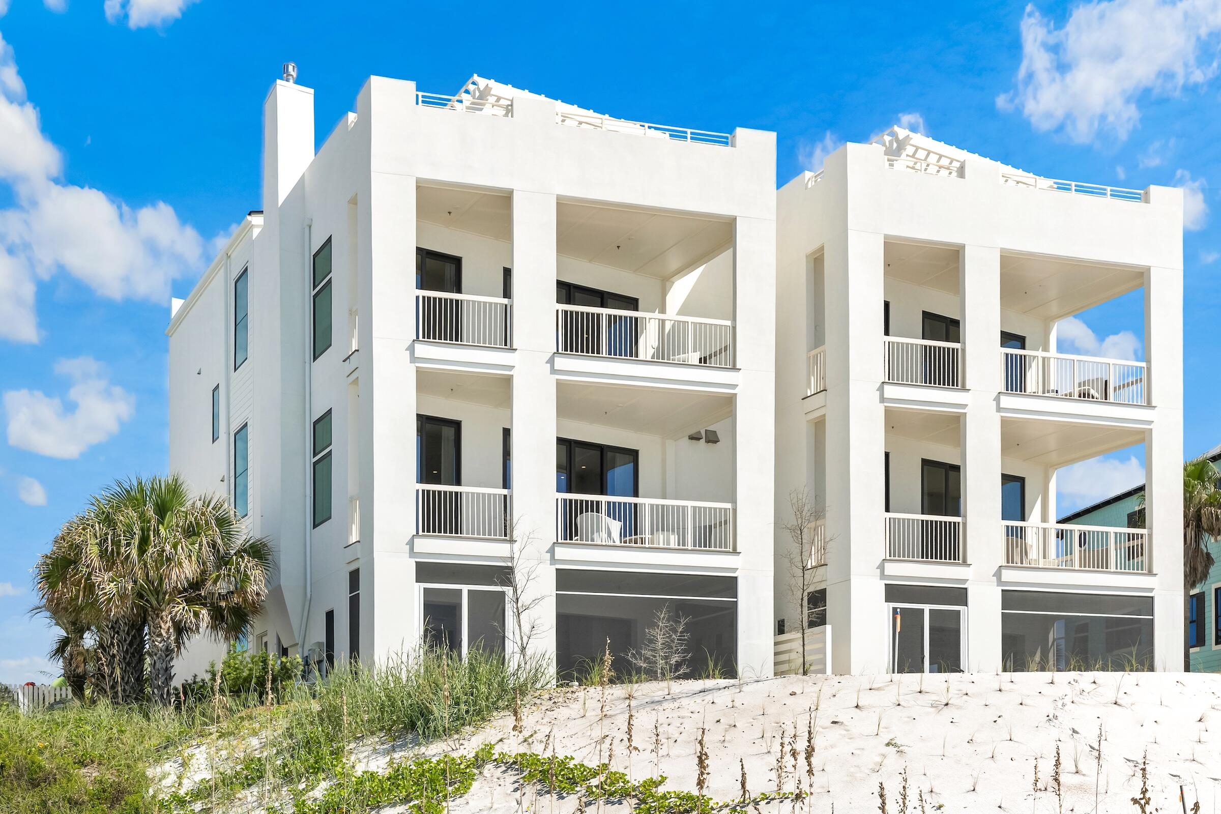 An extraordinary opportunity to acquire two newly constructed gulf-front residences together within Gulf Trace--one of Scenic Highway 30A's most secluded, coveted, and tightly held beachside enclaves. Offered as a single remarkable acquisition, Units A and B at 297 Gulf Shore Drive create the foundation for an exceptional private gulf-front family compound, providing two complete residences where multiple generations, extended family, and guests can gather while maintaining the privacy and independence of their own homes. Positioned directly on the Gulf of Mexico, these adjoining residences represent a caliber of new construction increasingly difficult to replicate along 30A. Each home spans four thoughtfully designed levels and has been meticulously conceived to take full advantage of its extraordinary setting, combining substantial construction, sophisticated architecture, exceptional finishes, and sweeping views of the Gulf.
 The interiors reflect an uncompromising commitment to craftsmanship and design. Sophisticated coastal palettes, exquisite quartzite surfaces, intricate custom tilework, modern cabinetry, premium luxury appliances, and carefully selected finishes create environments that are refined and timeless rather than traditionally coastal.
 At the heart of each residence is an impressive kitchen designed for both everyday living and large-scale entertaining. Oversized islands provide natural gathering spaces, while concealed walk-in sculleries offer additional preparation and storage areas that allow the primary kitchens to remain beautifully composed when entertaining.

Together, the residences offer ten spacious bedrooms, each with its own private ensuite bath, along with multiple living and gathering spaces designed to accommodate family and guests with remarkable ease. Premium residential elevators provide convenient access throughout all four levels of each home, allowing every generation to enjoy the residences comfortably.

At the uppermost level, spectacular rooftop terraces provide commanding 180-degree coastal views stretching from the lights of Destin toward Panama City Beach. Sunrise, sunset, and evenings beneath the stars take on an entirely different dimension from these extraordinary vantage points above the Gulf.

The connection between indoor and outdoor living is equally impressive. Each residence features its own private gulf-front pool deck and screened lanai, creating two distinct outdoor environments for swimming, dining, entertaining, and relaxing against the backdrop of the emerald waters and sugar-white sand for which this coastline is renowned.

The ability to acquire both residences creates possibilities rarely found along 30A. Parents, children, grandchildren, extended family, and guests can enjoy the experience of being together while retaining the comfort and privacy of separate residences. One home may serve as the primary family residence while the adjoining property accommodates extended family and guests--or both can function together as an expansive multi-generational coastal retreat.

Thoughtful accessibility has also been seamlessly incorporated into Unit B, including wider doorways, an accessible bedroom and bath, a zero-threshold shower, accessible entry, and elevator access throughout the residence. These ADA-compliant features have been carefully integrated into the overall design, providing enhanced comfort and ease of movement without compromising the home's sophisticated aesthetic.

What makes this offering truly exceptional is not simply the architecture, the new construction, or even the gulf-front setting. It is the opportunity to control both residences and create something increasingly difficult to find along Scenic Highway 30A: a private coastal legacy capable of accommodating generations of family in one extraordinary Gulf-front setting.

Whether envisioned as a multi-generational family compound, an exceptional retreat for family and guests, or a legacy property to be enjoyed for decades to come, the combined offering of Units A and B at 297 Gulf Shore Drive represents a remarkably rare opportunity to establish a substantial presence directly on the Gulf of Mexico within one of 30A's most treasured coastal communities.