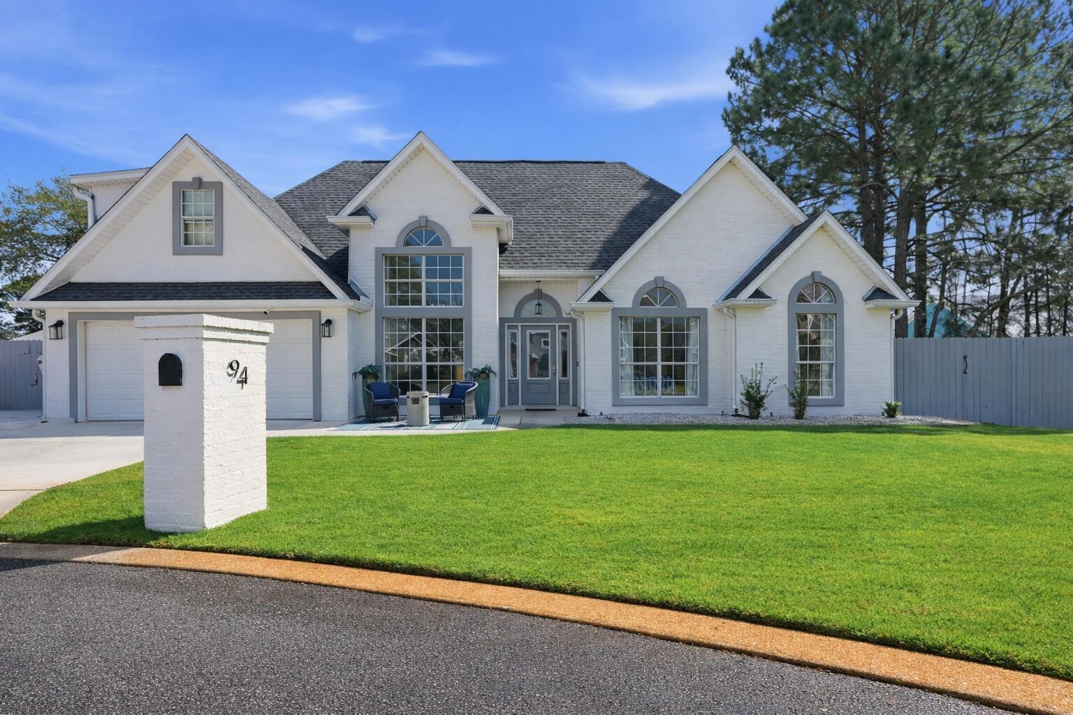 Tucked away on a quiet cul-de-sac beside a peaceful pond, this beautifully maintained coastal retreat offers a relaxed 30A-inspired luxury lifestyle just minutes from the sugar-white beaches of Miramar Beach. The home features a light-filled interior with vaulted ceilings, shiplap accents, & wide-plank flooring creating a bright coastal aesthetic throughout the open living & dining areas. The spacious primary suite features soaring ceilings & elegant finishes, while guest bedrooms provide comfortable accommodations. Updated baths showcase stylish tilework and modern fixtures. Outside, an expansive covered deck overlooks the pond and mature trees, creating a peaceful outdoor setting ideal for relaxing or entertaining. Perfect as a primary residence, second home, or investment opportunity.
