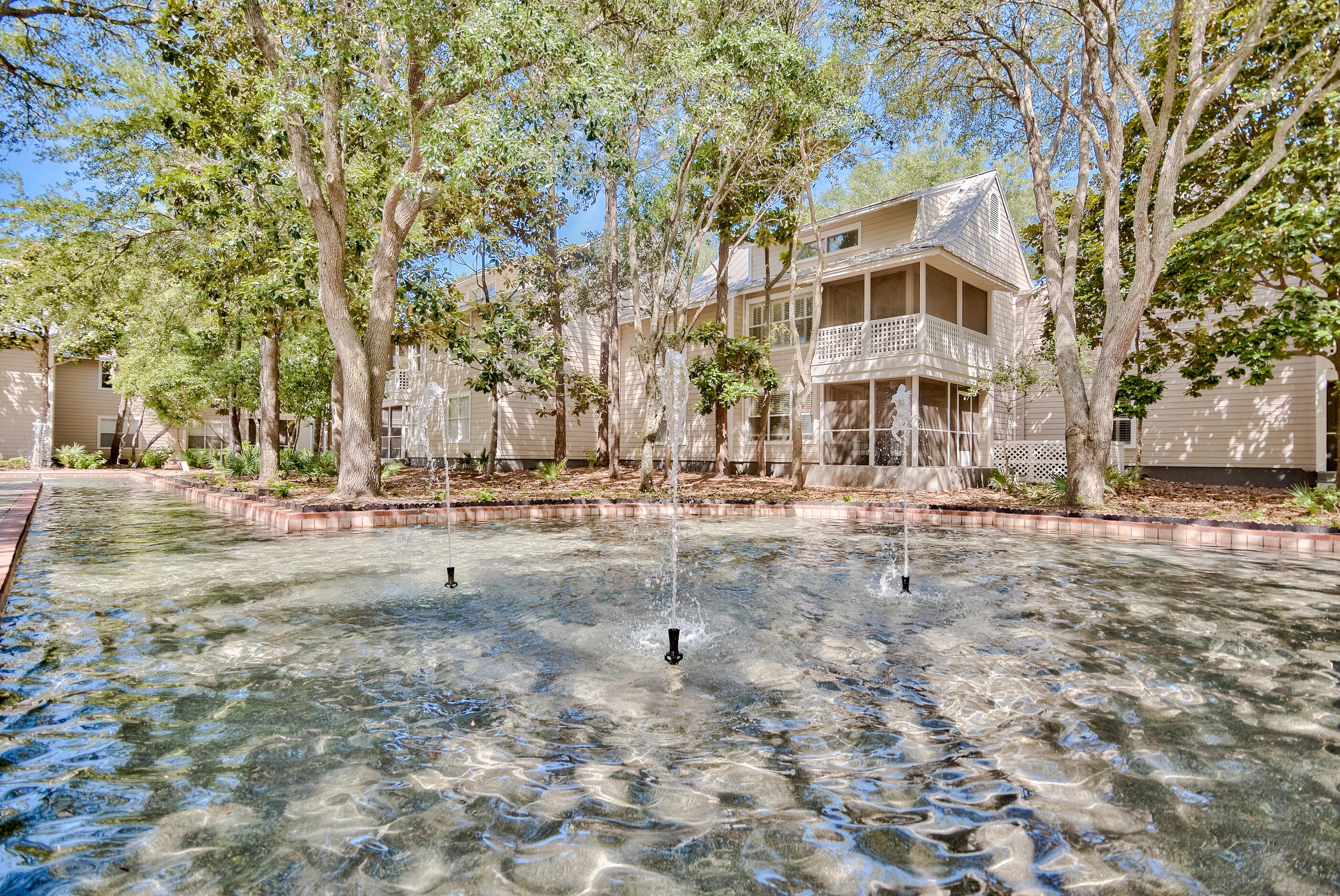 Located in a gated community with private deeded beach access, this beach cottage is full of character, charm, and quality craftsmanship throughout.
Step into an open-concept living space that's both functional and inviting. The living room is anchored by timeless built-in cabinetry and classic millwork, creating a warm and welcoming atmosphere.
Enjoy the benefit of expanded square footage—the former balcony has been enclosed and reimagined as a bright, airy dining area, effectively doubling your usable living space and offering the perfect spot to relax or entertain year-round.
The bathrooms have been elegantly remodeled, with tasteful updates that complement the home's coastal character. Additional custom touches include a built-in laundry closet crafted from rich Philippine mahogany, showcasing the attention to detail throughout.
This thoughtfully designed cottage blends style, comfort, and coastal living all within an amenity-rich, secure beachside community. 
Hidden Dunes is truly a hidden gem more peaceful and less crowded than many neighboring communities. This gated beachfront retreat offers a wide array of resort-style amenities, including a professionally staffed tennis center with six Rubico Clay Courts,3 new Pickleball Courts, seasonal beach tram service, a lighted basketball court, three swimming pools, BBQ grilling areas, and reflecting pools with flowing fountains. Enjoy scenic walking trails, lush landscaping, and the peace of mind that comes with 24-hour security.