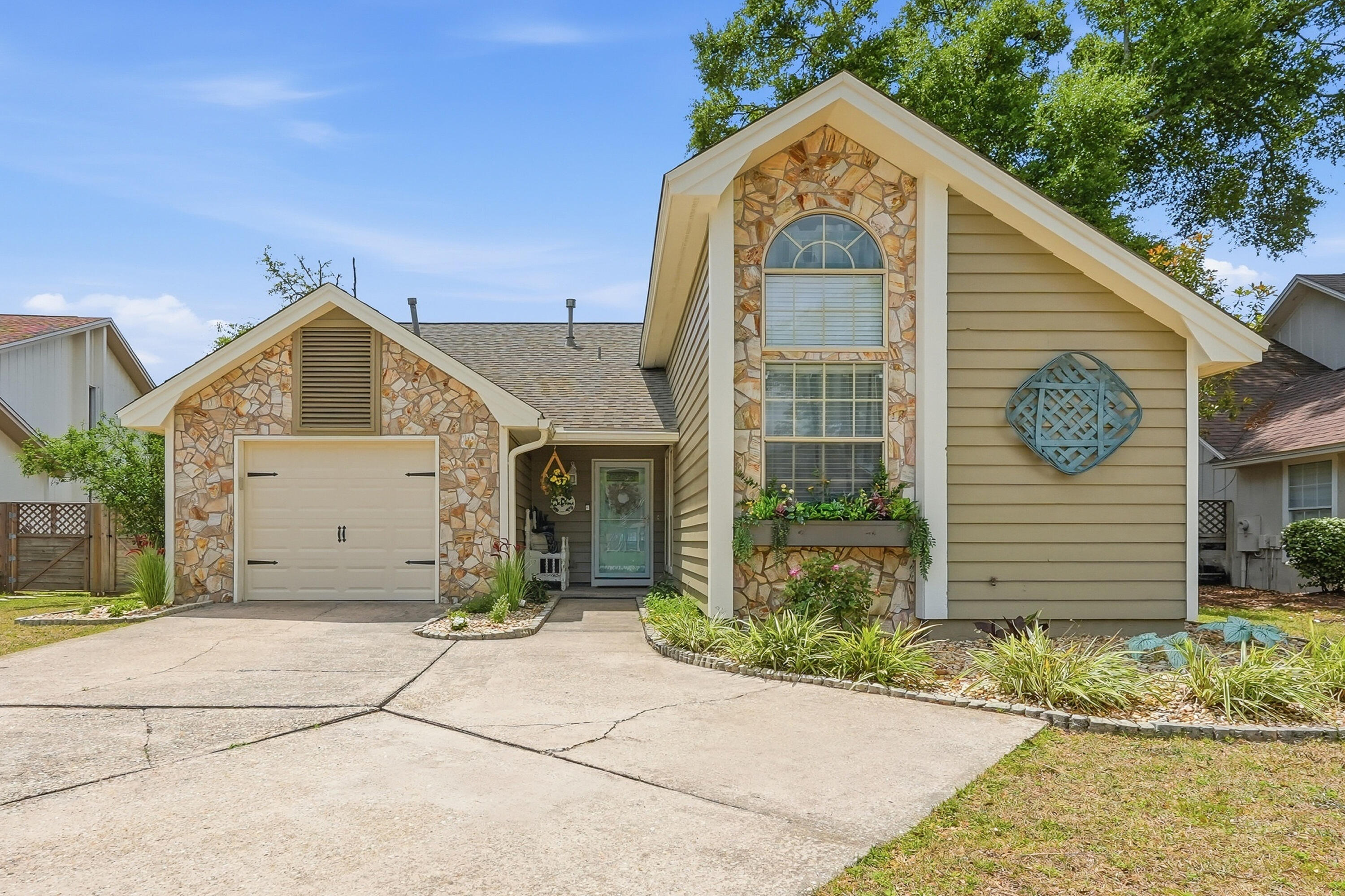 Don't miss your chance to call this one home. Tucked away on a quiet cul de sac in the sought after Crosswinds Landing neighborhood, this beautifully updated property offers the perfect mix of comfort, style, and convenience. Ideally located for coastal living, you are approximately 5 miles to Eglin Air Force Base, 8 miles to Hurlburt Field, and just 4 miles to the white sand beaches of Okaloosa Island and the Emerald Coast.
Inside, a welcoming entry flows effortlessly into the dining space and opens into a bright, airy living room with cathedral ceilings that elevate the entire main living area. Luxury vinyl plank flooring runs throughout, complemented by scraped ceilings, fresh interior paint, and updated baseboards and trim for a clean, modern feel. A gas fireplace with a custom wood mantle anchors the space and creates a warm, inviting focal point.
The kitchen has been thoughtfully updated with granite countertops, a raised bar for casual dining, matching appliances, a gas range, recessed lighting, soft close cabinetry, updated fixtures, and new windows. Granite continues into the bathrooms, creating a seamless, cohesive look throughout. Double French doors with built in blinds lead to a screened patio, perfect for relaxing or entertaining, while the backyard offers a spacious shed for additional storage.
The primary suite features a beautifully updated en suite with a custom barn door entry, dual vanities, updated lighting, a tiled rainfall shower, and a walk in closet.
An additional bedroom showcases custom herringbone built in bookcases and includes a full size Murphy bed concealed behind a stylish barn door, making it a perfect guest room or functional everyday space.
Major updates provide peace of mind, including a newer roof in 2023, water heater in 2024, HVAC system in 2024, and garage door in 2026.
Move in ready and thoughtfully upgraded, this home offers the ideal balance of location, function, and style with easy access to bases, beaches, and everyday conveniences.