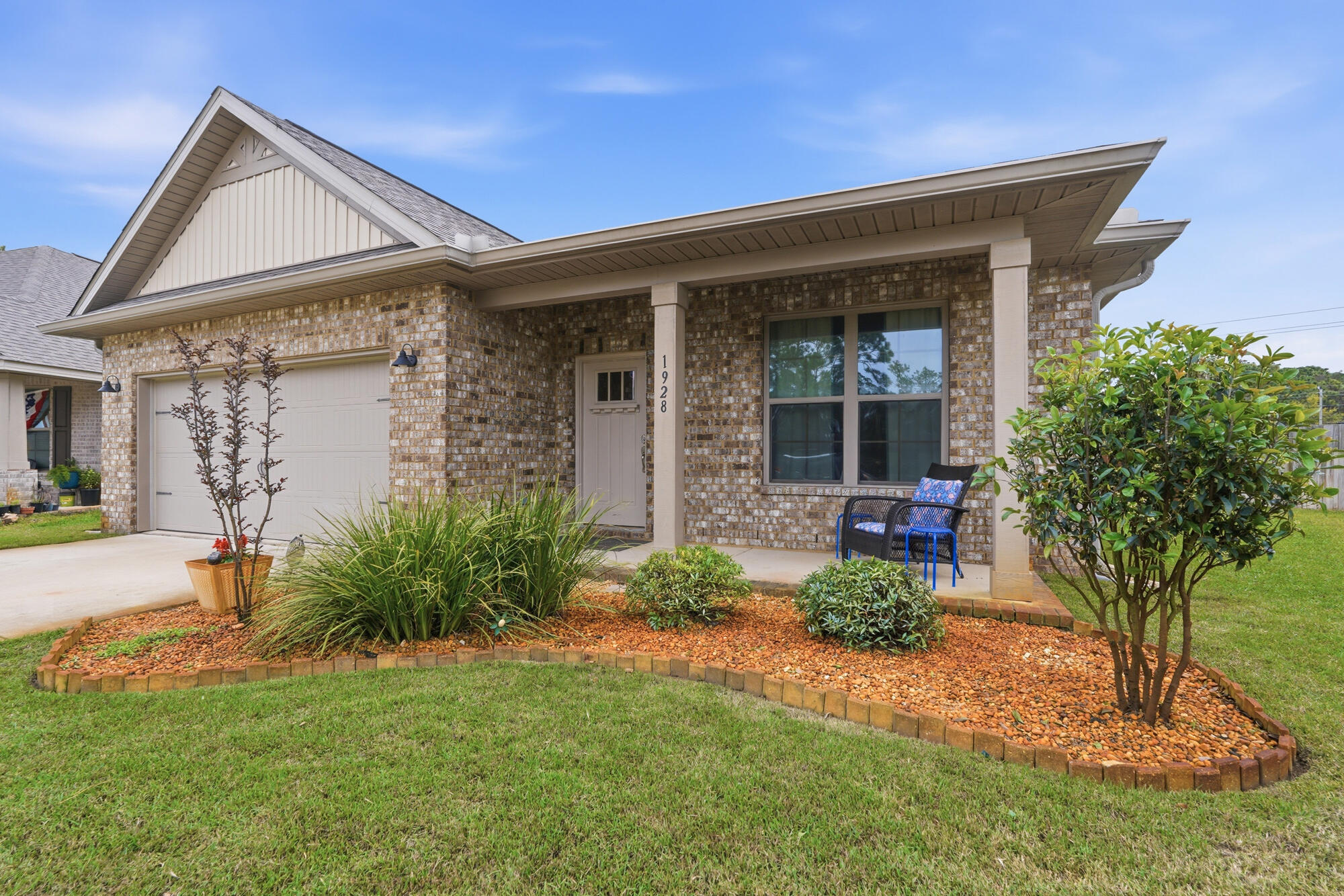 This beautifully designed 4-bedroom, 3-bath home offers a masterclass in comfort and convenience. The spacious, open split floor plan is accented by elegant crown molding, granite countertops, luxury plank flooring and carpet, and a brand-new stove (2025). Relax by the electric fireplace or retreat to the primary suite's spa-like bath with a garden tub.

Step outside to a covered front porch perfect for birdwatching and pine tree views, or enjoy the covered back porch overlooking a lush Zoysia lawn. The large, fenced-in backyard features pear, plum, nectarine, apple, peach and grapefruit trees, a large storage shed, and a dedicated irrigation system with a well pump. Two-car garage, driveway, and two additional parking spaces.

Located just 1 mile from the zoo and the  high school, you are perfectly positioned for work and play. Enjoy Soundside water access and boat ramps just 3 miles away, or take a short 7-mile drive to the stunning Navarre Beach to enjoy live music and sea turtle conservation. Schedule your tour today!