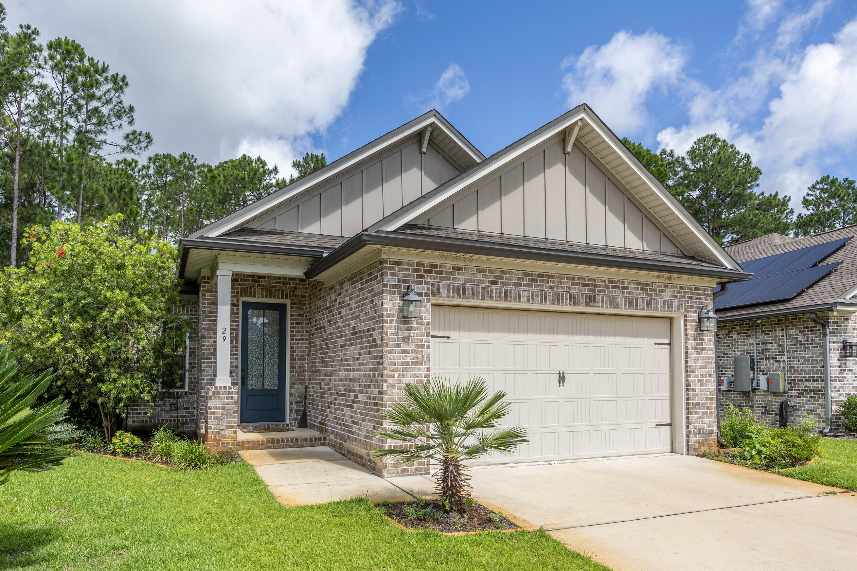 Welcome to this beautifully maintained Randy Wise home in the sought-after Marina Village community, ideally located just minutes from Scenic Highway 30A and the tranquil shores of Choctaw Beach. Backing to a peaceful pond with no future development behind it, this home offers privacy, scenic views, and a beautifully landscaped backyard.

The open-concept floor plan features tray ceilings, recessed lighting, abundant natural light, and luxury vinyl plank flooring throughout the main living areas. The spacious kitchen is beautifully appointed with granite countertops, a ceramic subway tile backsplash, stainless steel Frigidaire Professional appliances, a Whirlpool French-door refrigerator, flat-top electric range, bronze cabinet hardware, and a walk-in pantry. The laundry room is plumbed for a utility sink.

The primary suite offers a large walk-in closet and a spa-inspired bath with dual vanities, a soaking tub, tiled walk-in shower with bench seating, and a private water closet. Additional highlights include a two-car garage, well-fed irrigation system, and comfortable guest bedrooms.

Marina Village amenities include a community pool, playground, and marina within walking distance. Conveniently located near shopping, restaurants, grocery stores, schools, a water park, and a premier sports complex with tennis, pickleball, baseball, soccer, and basketball. This home offers the perfect blend of coastal living, comfort, and convenience.
