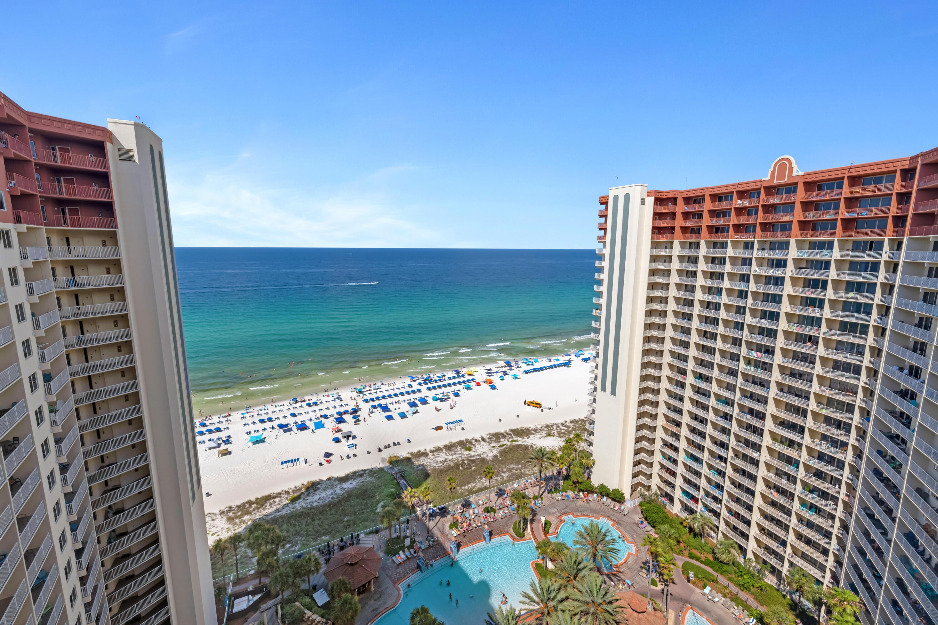 20TH FLOOR. GULF-SIDE PRIMARY. DEEDED PARKING.
Shores of Panama 2020 brings the 20/20 vision concept to life with Gulf and pool views from a higher-floor position in one of Panama City Beach's most recognized Gulf-front resorts. Located on the 20th floor in the 20 stack, this L floor plan offers 2 bedrooms, a bunk area, 2.5 bathrooms, three sleeping areas, and a large balcony accessible from both the living room and the Gulf-side primary bedroom.
The interior features tile flooring throughout the entire unit, a fully equipped kitchen with stainless steel appliances, granite countertops, and a tile backsplash. The hallway includes a stackable washer and dryer, and the condo is offered turnkey for continued use and enjoyment. The primary bedroom includes Gulf views, a king-size bed, and a sliding glass door opening directly to the large balcony. The primary bathroom has been updated with a double vanity and glass shower door, while the second bedroom includes a queen-size bed. A deeded parking space on the 10th floor adds an important convenience within the resort.
Shores of Panama Resort features one of the largest Gulf-front lagoon-style pools in Panama City Beach. The zero-entry tropical pool includes palm-lined islands, fountains, and a spacious hot tub along the resort's private beachfront access. Additional amenities include an indoor heated pool and hot tub, a 24-hour fitness center, and a seasonal poolside Tiki bar. Located in the heart of Panama City Beach, Shores of Panama places dining, shopping, and entertainment nearby. Pineapple Willy's is adjacent to the resort, while Laketown Wharf directly across the street offers dining, retail, and entertainment options including Wharf Seafood Buffet, The Candymaker Ice Cream Shop, PCB Pizza, In Cahoots, The Press, The Bun Lab, 810 Billiards & Bowling, salon services, and more. Panama City Beach has also welcomed newer attractions and entertainment venues including Dolly Parton's Pirates Voyage Dinner & Show, Topgolf, McGuire's Irish Pub, and Tootsie's Orchid Lounge.

HOA dues are $3,705.85 per quarter. 
All information, rental income, HOA fees, assessments, measurements, and property details are deemed reliable but not guaranteed; buyer to verify if important.