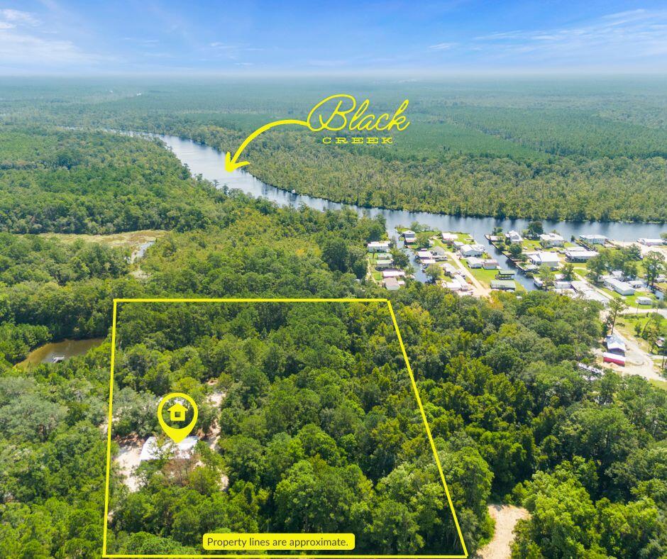 Investor's Dream & Homesteaders' Paradise Roll into One! Welcome to 6.255+/- pristine, versatile acres offering the perfect blend of privacy, utility, and immediate cash flow. Good news--flood insurance is not required for the existing structures, offering fantastic peace of mind and lower holding costs! Currently generating $2,500/month in rental income, this unique property is a goldmine for an investor, a business owner, or someone looking to live for free while land-banking for the future.

The acreage is exceptionally equipped with a massive 40x60 pole barn and a secondary 24x36 pole barn, perfect for heavy equipment, workshops, or ultimate storage. Ready for immediate use, the land features hookups for 4 campers, serviced by city water and a well-maintained, fully functional septic tank. Enjoy dual road access via both Blue Gill Rd AND Shell Cracker Rd, making navigation and future development a breeze.

Situated in a rapidly growing area, you are just minutes from local amenities, yet tucked away enough to enjoy peaceful, rural privacy. Bonus: The existing mobile home is available for purchase at an additional cost, or the sellers will remove it before closing. Properties with this level of infrastructure and immediate income do not last. Schedule your tour today and grab your piece of fast-growing real estate!
