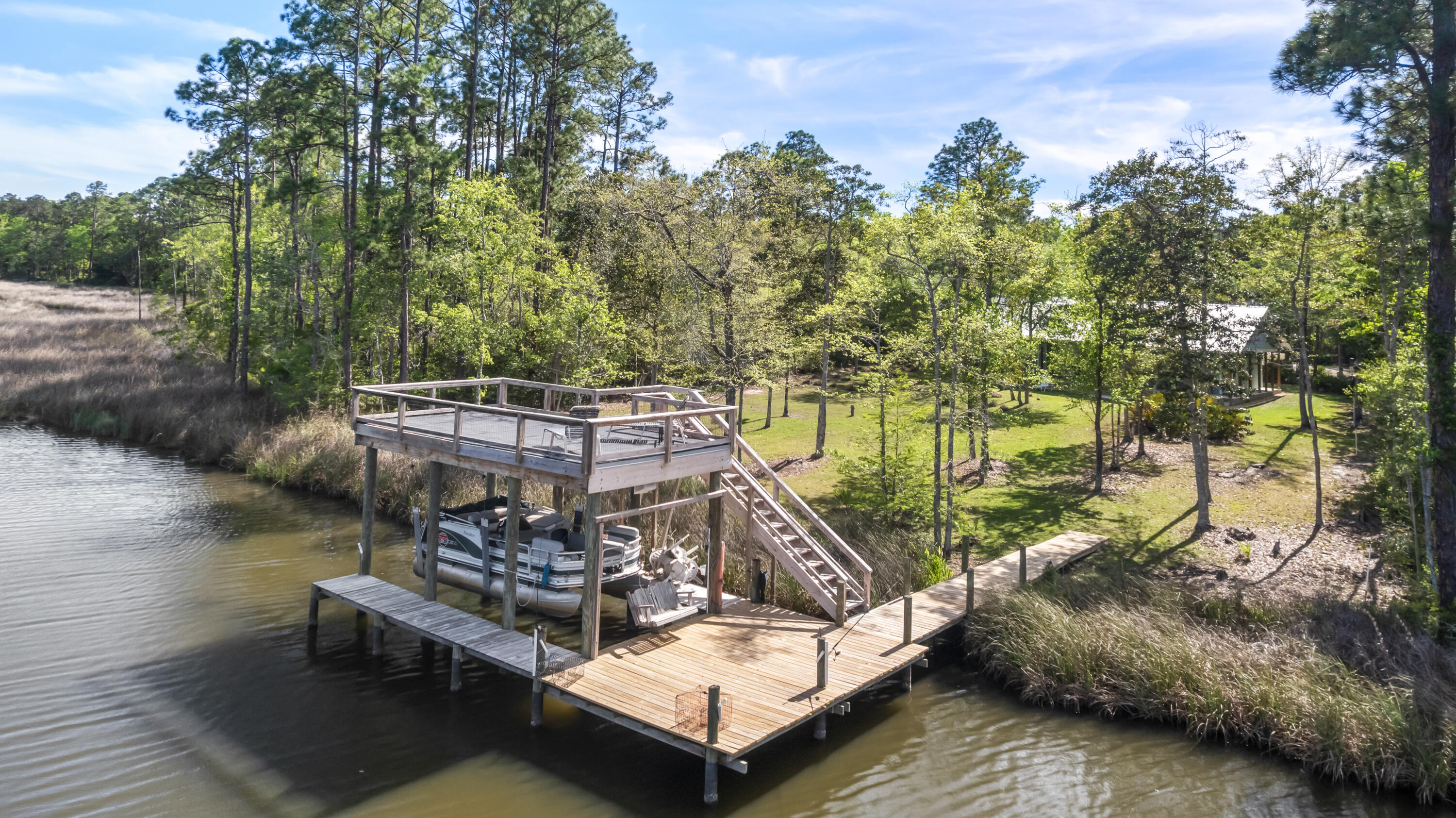 Welcome to this beautifully maintained waterfront 3-bedroom- 2 bath home tucked away into one of Freeports most peaceful and scenic cooridors.Once inside you are greeted by natural light and open concept living space.Outdoors ,the property shines even brighter. Surrounded by mature trees and the gentle breezes from the bay, 
the yard offers a sense of privacy and serenity that is hard to find. This home makes everyday living feel like a getaway. Just moments away from the Clyde B. Wells Bridge, you will enjoy quick access to the beaches of South Walton. local shops and all the conveniences of Freeport.  528 Bay grove Road is more than a house- it's a place to slow down, breathe deeply, and truly feel at home. Waterfront living at its best- call for your private viewing today .