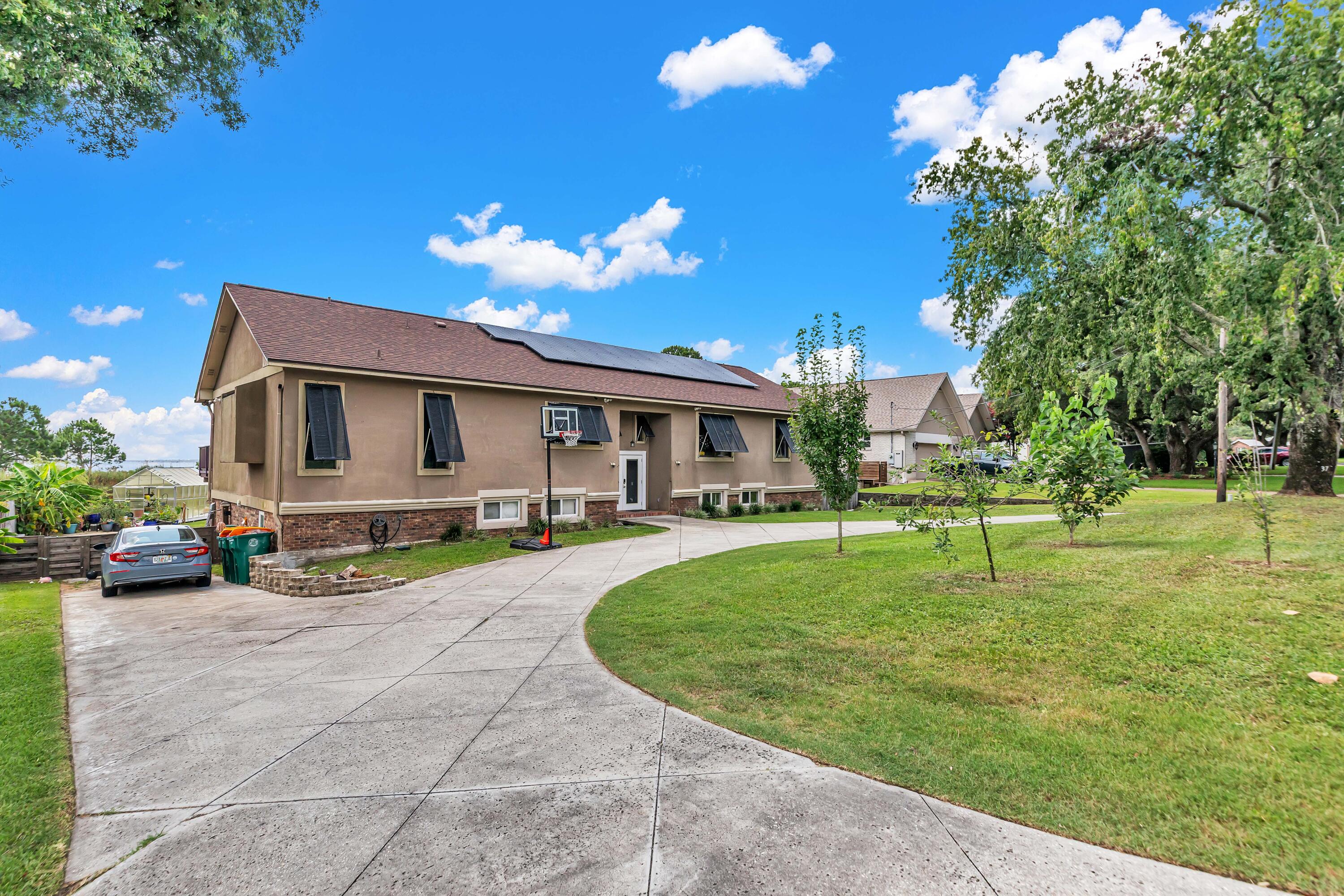 PAID OFF SOLAR PANELS! Seller willing to pay for $13k quoted pool liner repair with an acceptable offer.
Roof and HVAC- 2-3 years old
Upstairs- Brand new tankless W/H 

This beautiful Lake Lorraine home offers you with amazing panoramic views of the Choctawhatchee Bay. Wake up to the natural scenes that are complete with wildlife in the lagoon and boats passing by in the bay. Charm and character are visible throughout this multi level home. Ideal for a large family and perfect for entertaining. The sunken living area is partnered with glass doors providing the incredible view but also tons of natural light. Upstairs offers a master and full bath, a bedroom with a full bath, 1/2 bath and the laundry room with a closet (Can be turned into a bedroom), dining area and kitchen.  Lower level has 1 master bedroom with full bath, additional bedroom, another full bathroom and two half bathrooms With 4 additional rooms (no closets but room to add), Two sets of washer/dryer hookups downstairs and one upstairs, and a bath accessible from outside making it the perfect pool bathroom. 

Exterior.. Seller's planted pear, apple and mulberry tree (front) and Banana, Olive and pineapple guava trees (Back). In ground pool, fenced in for safety, RV parking that includes electrical and sewer, solar panels (Paid Off) which gifts you with only about a $40 power bill. Don't miss it!