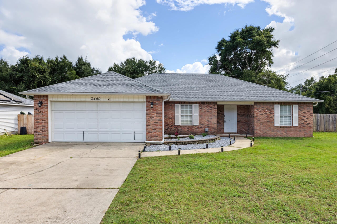 Fairchild Estates • New roof 2023 • Corner cul-de-sac lot • Split-bedroom layout • Fenced back yard Located in Fairchild Estates, 3400 Skymaster Court in Crestview offers 3 bedrooms, 2 baths, and 1,854 square feet on a 0.31-acre corner lot. The split-bedroom floor plan centers around a spacious great room with vaulted ceiling details, plus a dining area, breakfast space, pantry, and practical kitchen layout. Recent updates include a brand-new roof installed in December 2023, new LVP in the main living area, fresh interior paint, updated lighting, and new hardware throughout. The primary suite features a tray ceiling, dressing area, soaking tub, and separate shower, while laminate, vinyl, and carpet flooring add function across the home. Outdoor features include a fenced back yard, open patio, level lot, and yard building for extra storage. A 2-car attached garage with opener, public water, and septic system add everyday convenience. Set on a dead-end cul-de-sac street in Crestview, this home is near local shopping, dining, parks, schools, and major north and south routes through Okaloosa County.