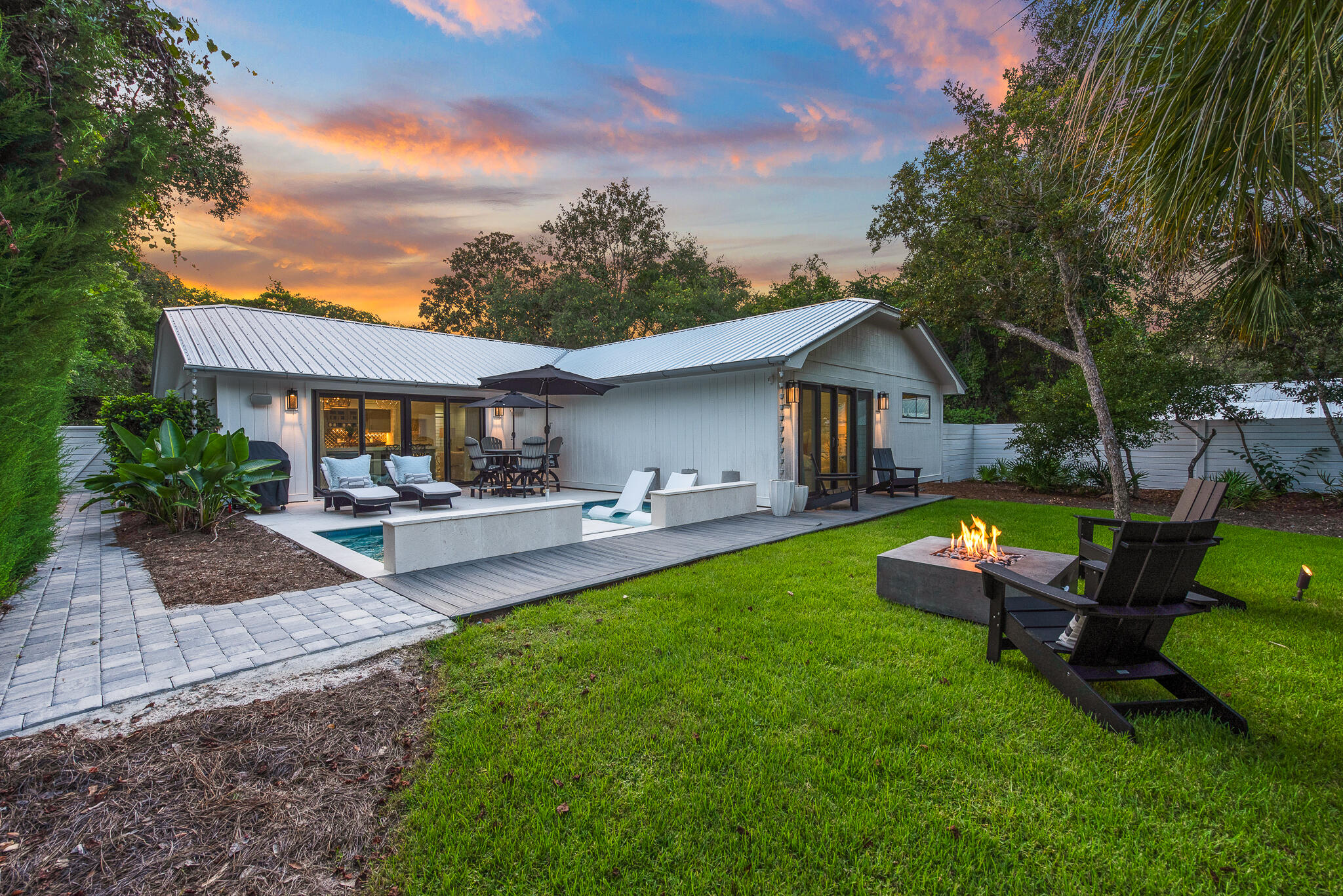 This fully renovated and expanded home is in the perfect location allowing for a quick walk to the beach, Seaside, Watercolor, and Publix. Situated on a large flat lot in the HOA free neighborhood of Old Seagrove, this inviting 3 bedroom, 3 bath home includes a garage, pool and large fenced in back yard. This low-maintenance home is ideal for a permanent residence, quick getaway or as an income producing property. Nightcap street provides a deeded access to a county owned beach. The path to the beach is shaded by canopies consisting of magnolias and live oak trees. In addition, Nightcap is a North-South street, which is a less traveled road in Old Seagrove. The size of this lot is a quarter acre. The lot consists of no wetlands and is located in the preferred flood zone X. The aforementioned renovations include a new roof, added pool, updated kitchen and bathrooms, paint inside and out, light fixtures, ceiling fans, and landscaping.