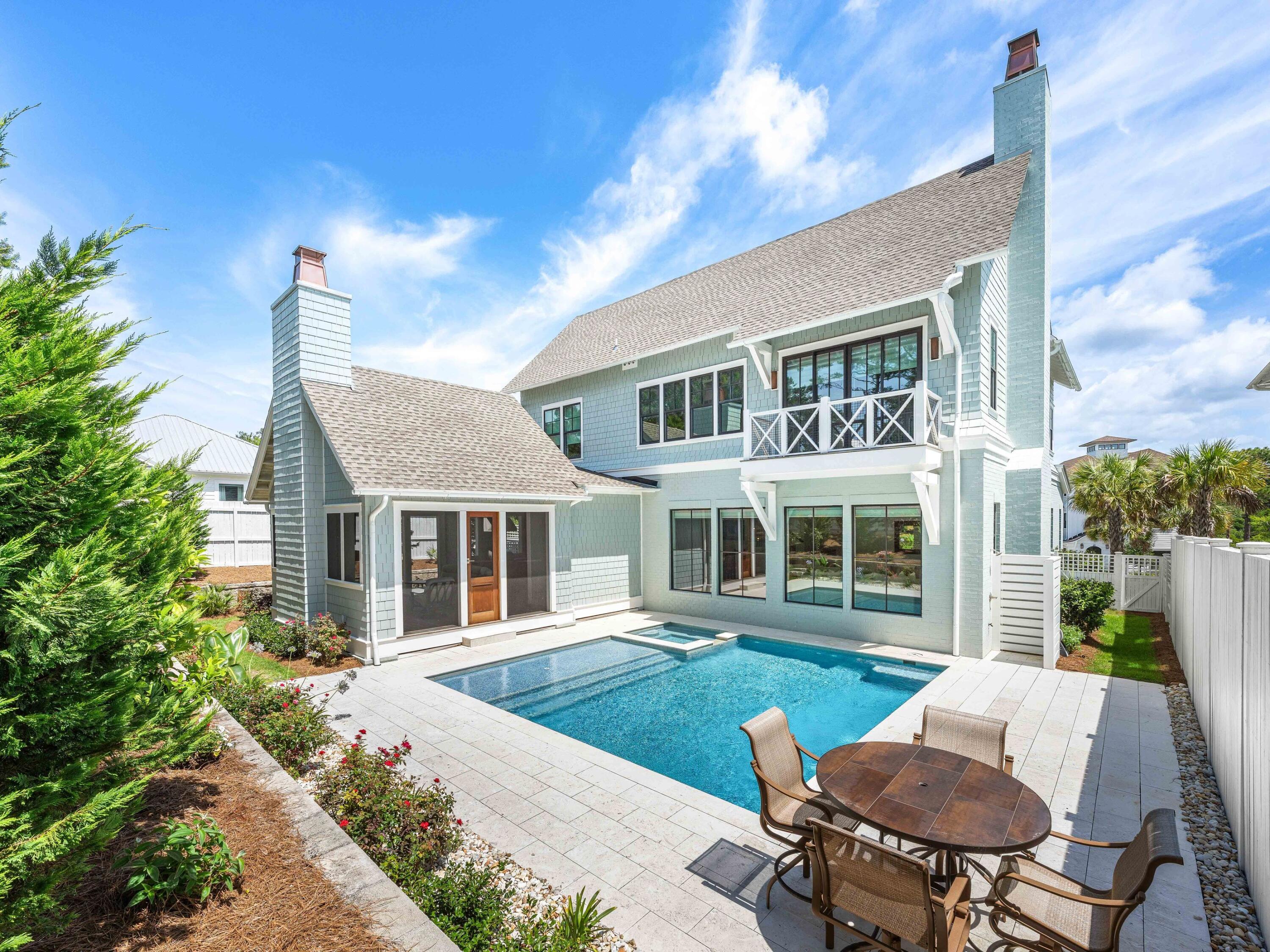 Experience the epitome of coastal living at this exquisite residence, harmoniously blending privacy, convenience, and coastal elegance. The property spans 4,075 square feet and features four bedrooms, four full bathrooms, 2 powder baths, a private pool and spa, and a three-car garage.
Nestled along a secluded street, this impeccably designed oasis offers serene tranquility just steps from 30A and the beach. A brand new golf cart valued at $20,000 is included in the sale, simplifying the turnkey experience.
Upon entering, you will be greeted by an elevated interior adorned with Venetian plaster, designer wallpaper, mitered and coffered ceilings, white oak hardwood floors, and beautifully tiled bathrooms throughout. The first level seamlessly transitions from an open concept living and dining area to a chef's kitchen equipped with a spacious center island, quartz countertops, mosaic tile backsplash, Wolf & Sub-Zero appliances, and extensive custom cabinetry.
The screened outdoor porch, complete with a summer kitchen and fireplace, provides an ideal setting for relaxation. An outdoor sanctuary includes the heated pool, spa, sun shelf and a dedicated bathroom. A junior primary suite is located on the main level, featuring a spacious ensuite bathroom. A custom laundry and sandroom, complete with built-in bench, lockers, and cabinets, ensures the organization of beach gear. Ascending to the second floor via elevator or custom staircase, you will discover the grand primary suite boasting raised ceilings, a retreat spa bath, walk-in custom closet and a private balcony overlooking the backyard. A secondary living/flex space, two guest bedrooms with ensuite bathrooms and laundry complete the upper floor. 
Additional upgrades include a Halo Air Purifier system, epoxy-finished garage floors and designer lighting throughout, enhancing the residence's impeccable appearance.