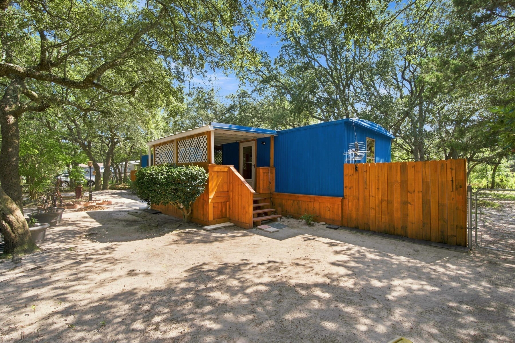 AFFORDABLE NAVARRE LIVING JUST MINUTES FROM THE WATER - WITH NO HOA! Whether you're searching for a full-time home, weekend getaway, or investment opportunity, this 2-bedroom, 1-bath home offers an incredible opportunity to own in one of the Florida Panhandle's most desirable coastal communities without the typical coastal price tag. LOCATION is the star here! Located approximately 2 minutes from the Holley by the Sea boat ramp, you can have the boat in the water and be on your way to the Santa Rosa Sound, Crab Island, Destin, or a day along the Gulf Coast in no time. Restaurants, shopping, beaches, boating, fishing, and everything the Navarre lifestyle has to offer are all conveniently nearby. With NO HOA, a fully fenced yard, large 20x20 storage shed, and a newer covered front porch, the property offers plenty of flexibility for a primary residence, second home, or investment. Inside you'll find 2 bedrooms and 1 bathroom along with updated electrical, while the metal rolled roof includes an additional peel-and-seal layer for added protection and reduced rain noise. Best of all, this isn't necessarily a cash-only opportunity - financing options may be available, and preferred lenders familiar with this type of property can be provided. If you've been waiting for an affordable way to own near the beaches and waterways of Navarre, THIS IS IT. Skip the condo fees. Skip the HOA. Bring the boat, bring the beach gear, and make your Florida lifestyle happen!