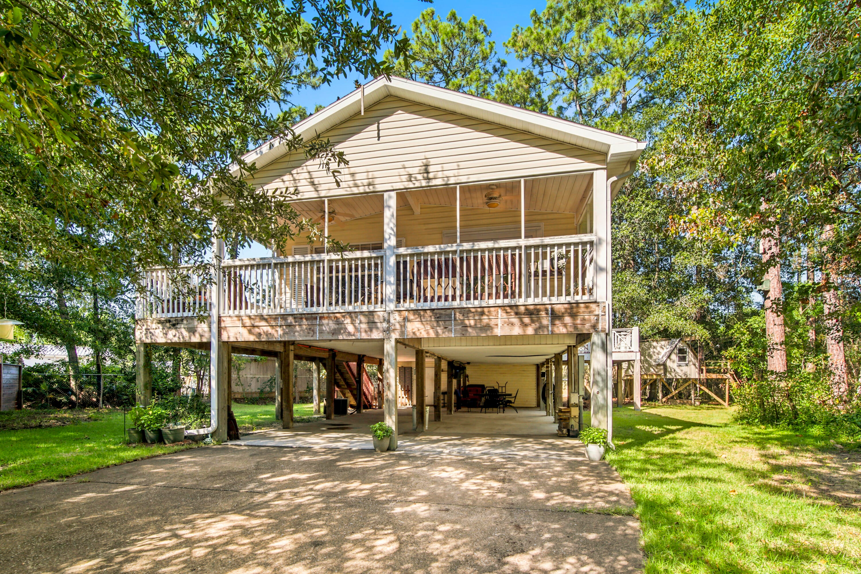 Welcome to 248 Plantation Way, a well-loved and maintained home offering exceptional privacy at the end of a quiet cul de sac in Palmetto Plantation. This 3-bedroom, 2 bath property features 1,111 sqft of heated and cooled living space with a total footprint of 2,761 sqft, thoughtfully designed and built on pilings for durability and elevated coastal living. 
With ample space to park multiple vehicles -- including room for a boat -- this home is ideal for those who love to explore the water. Enjoy two inviting sitting porches perfect for morning coffee or evening relaxation. A 200 sqft workshop and a 12×16 shed provide valuable storage and hobby space rarely found at this price point.
The community pool is just steps away, and you're minutes from Cessna Landing boat launch and the world-famous beaches of 30A. Whether you're seeking a peaceful primary residence or an investment opportunity, this property shines as a strong option for both long term and short-term rental potential.
Experience the comfort, privacy, and convenience that make this home truly special.