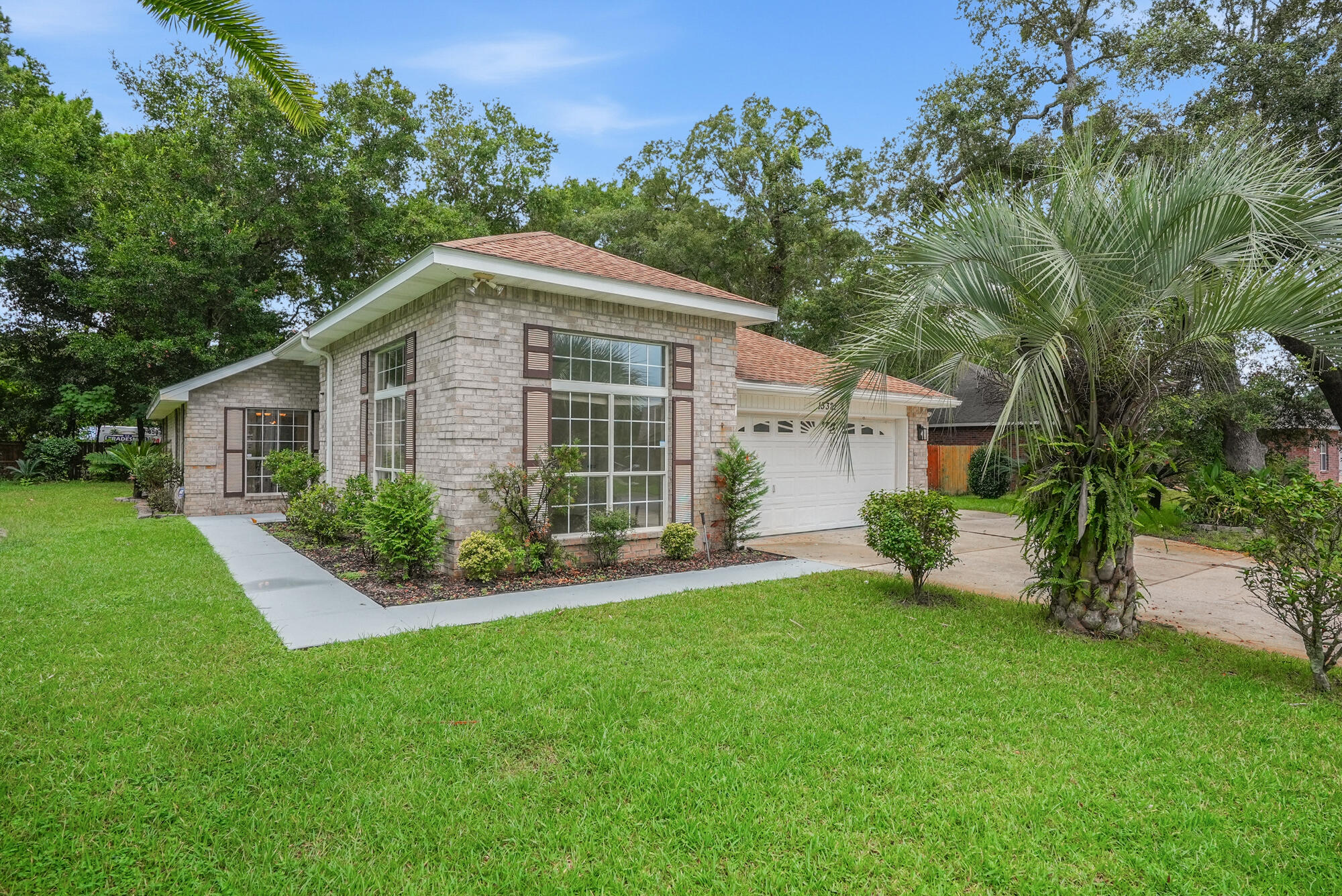 Escape to Paradise at 13321 Paradise Beach Place!

Welcome home to this beautifully maintained all-brick, 3-bedroom, 2.5-bath home in West Pensacola, where comfortable living meets the laid-back coastal lifestyle. With approximately 1,897 square feet of living space and a spacious homesite just shy of half an acre, this property offers plenty of room to relax, entertain, garden, and enjoy the outdoors.

One of the neighborhood's standout features is private owners' beach access on beautiful Perdido Bay! Imagine ending your day with a short stroll to the bay to watch a breathtaking sunset, launching your kayak or paddleboard for an afternoon on the water, fishing from the pier, or simply relaxing along the shoreline. This is the Florida lifestyle you've been looking for!

Step inside to a bright and inviting interior filled with abundant natural light and fresh, neutral white walls that provide the perfect blank canvas for your personal style. New LVP flooring adds a clean, updated look while offering easy maintenance for everyday living. The spacious kitchen provides plenty of room for gathering, cooking, and entertaining family and friends. The primary suite offers a relaxing retreat, complete with a garden tub that's perfect for unwinding at the end of the day. Two additional bedrooms provide flexibility for family, guests, a home office, or hobby space.

Outdoor living is just as enjoyable! Spend your mornings with coffee or your evenings relaxing on the large screened-in back porch, plus enjoy the convenience of a second covered patio for even more outdoor entertaining space. The generous backyard gives kids and pets room to play without feeling crowded by neighboring homes, and the storage shedprovides plenty of space for lawn equipment, tools, fishing gear, beach toys, and more.

Major updates offer additional peace of mind, with the roof and HVAC approximately 6 years old. Even better, no flood insurance is required.

Location is another huge plus! You're conveniently located near Pensacola Naval Air Station, Corry Station, shopping, dining, boating, and recreation, while the gorgeous white-sand beaches of Perdido Key are just minutes away.

Whether you're spending the afternoon kayaking on Perdido Bay, enjoying a sunset from the neighborhood pier, entertaining on your screened porch, or making the quick trip to Perdido Key, 13321 Paradise Beach Place makes it easy to enjoy the best of Northwest Florida living.

Paradise isn't just in the name--it's the lifestyle! Schedule your private showing and come see everything this beautiful home and waterfront-access community have to offer!