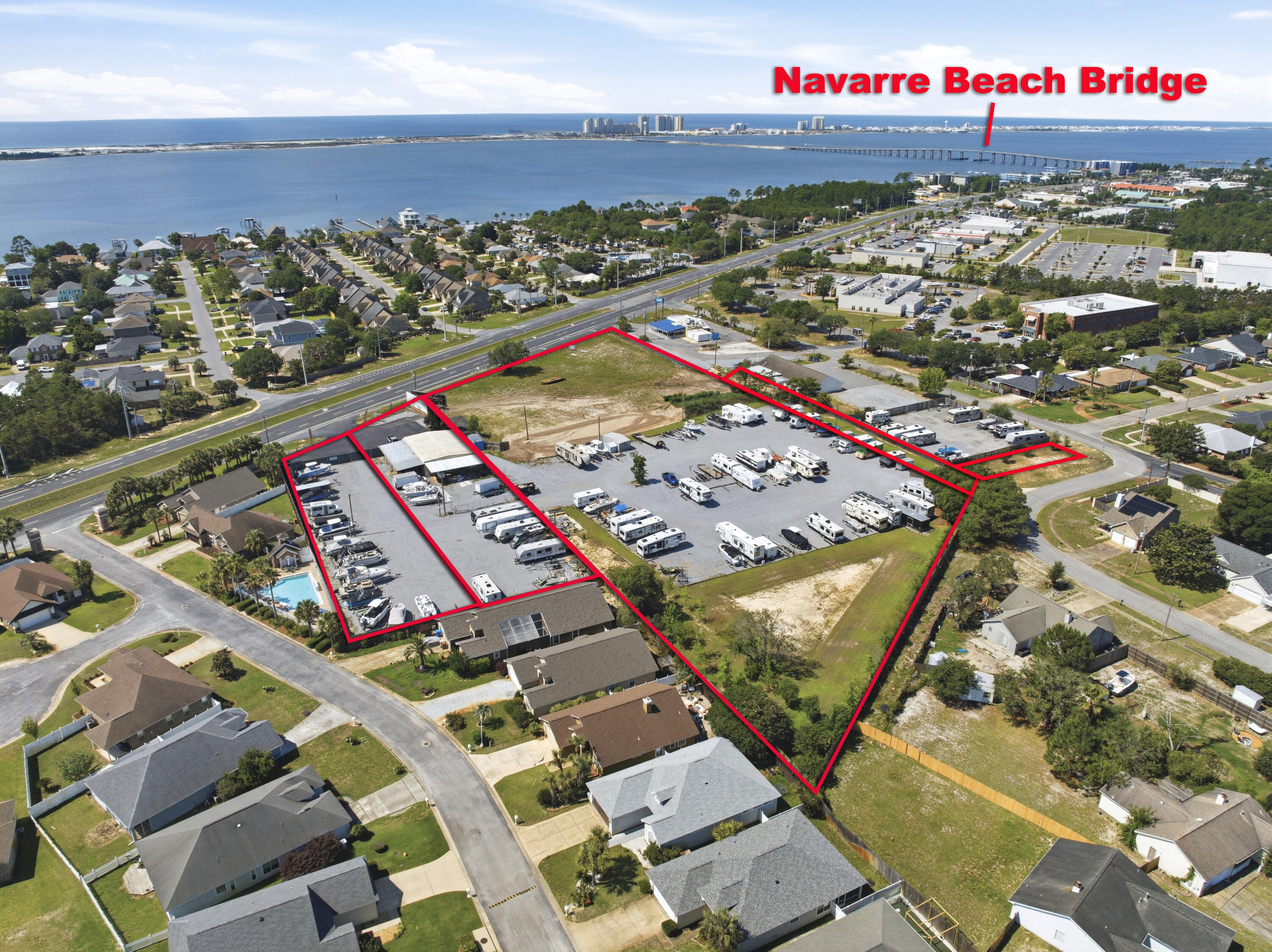 DIRECT HWY 98 facing LAND FOR SALE. FIVE PARCELS FOR SALE. 21-2S-26-0780-0BB04-0000; 21-2S-26-0780-0BB03-0000; 21-2S-26-0780-0BB06-0000; 21-2S-26-0780-0DD00-0000; 21-2S-26-0780-0EE00-0000 which includes income producing 4560 sq ft building currently housing a retail building; billboard; and boat/rv storage. There is access from Highway 98 AND paved road access to the property from Burjonik Drive.  This is an excellent opportunity to own over 6 acres and build a retail development directly on Highway 98 where more than 41,000 cars pass by each day. Large commercial property in Navarre is almost nonexistent so don't miss this opportunity to own in one of the fastest growing counties in the state! Owner is also willing to split the parcels.