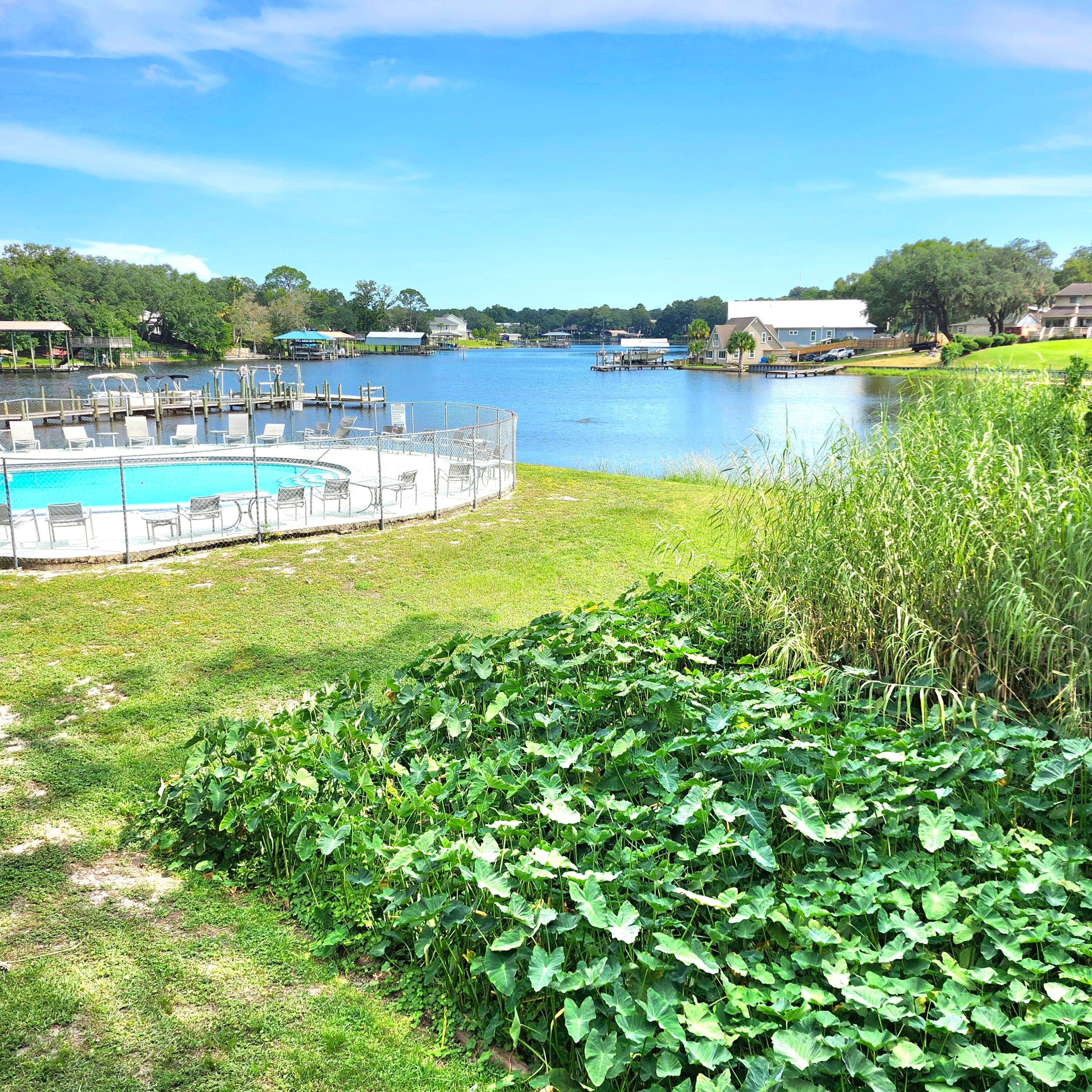 Waterfront unit directly on Cinco Bayou. Great view from the balcony and bedroom overlooking the bayou and a natural preserve area.  Boat slips are available, at no cost, on a first come first serve basis.  There is a dry storage area available as space allows.  The complex offers a dock, boat slips, fishing, fish cleaning station, pool, tennis/basketball court and on-site laundry facility.  Large living/dining room opens to kitchen.  Kitchen offers breakfast bar, built-in microwave, pantry cabinet and tile backsplash.  Large bedroom on the water with access to the balcony. The bathroom features a tile walk-in shower and separate vanity area.  Tile flooring throughout the unit. The HVAC was installed in 2021 and the hot water heater was installed in August 2026.  This unit is move-in ready.