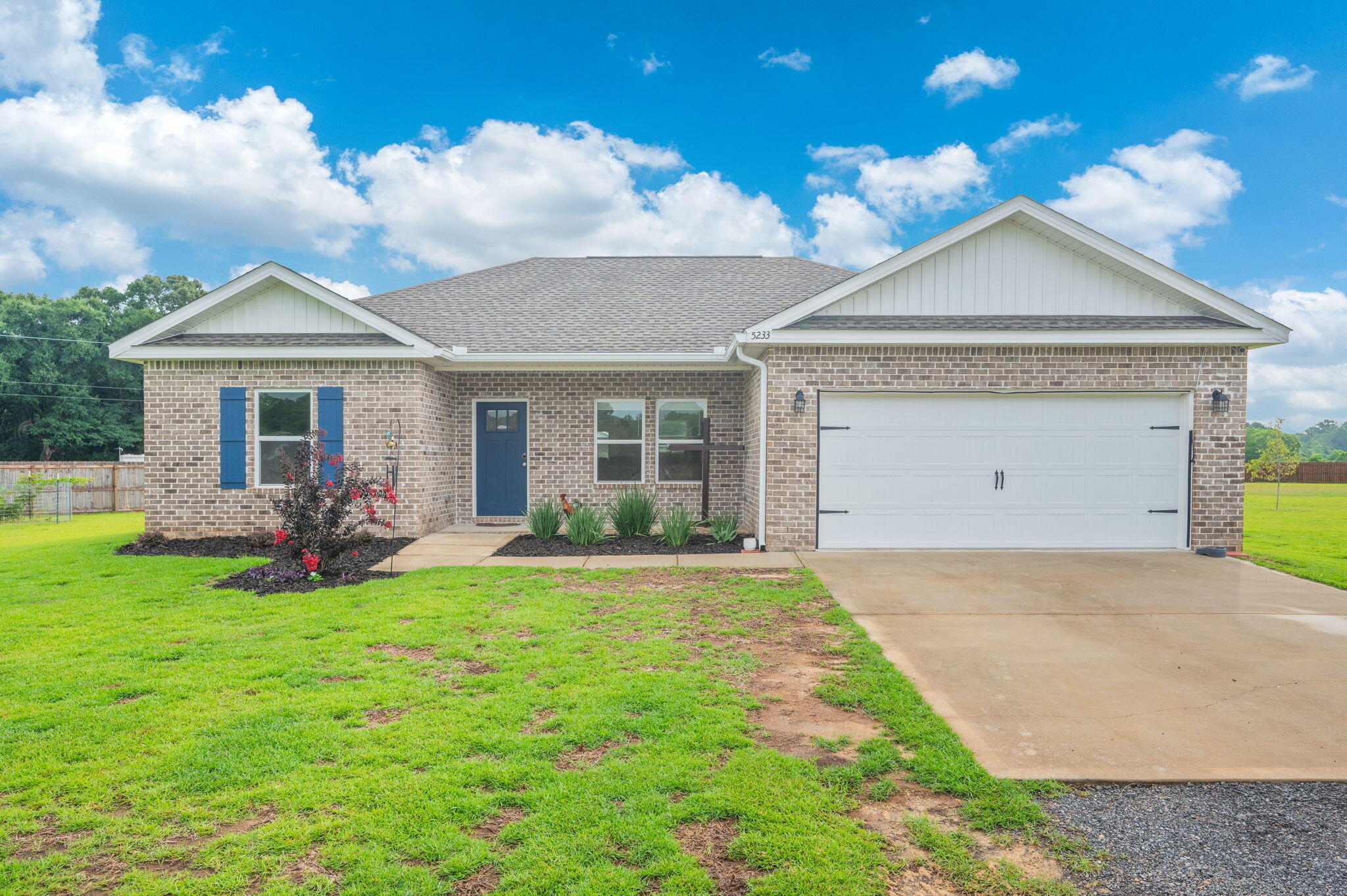 Welcome home to peaceful country living on a stunning 1.66-acre lot in Baker! This beautiful all-brick, 3-bedroom, 2-bath home offers the perfect blend of comfort, style, and space. The fully fenced yard with a gated entrance provides privacy and plenty of room to enjoy the outdoors. Inside, you'll love the open, split-bedroom floor plan with soaring ceilings and abundant natural light. The kitchen is designed for both everyday living and entertaining, featuring white shaker cabinetry, quartz countertops, stainless steel appliances, a center island, and a walk-in pantry. The primary suite is a true retreat, featuring an oversized walk-in closet and an ensuite bath with dual vanities. Throughout the main living areas and primary bedroom, luxury vinyl plank flooring adds both style and durability. Outside, gutters have already been installed for added convenience and peace of mind. Complete with a two-car garage and situated on a gorgeous lot with endless possibilities, this property offers the tranquility of country living while still being conveniently located. Don't miss your opportunity to own this charming Baker home!