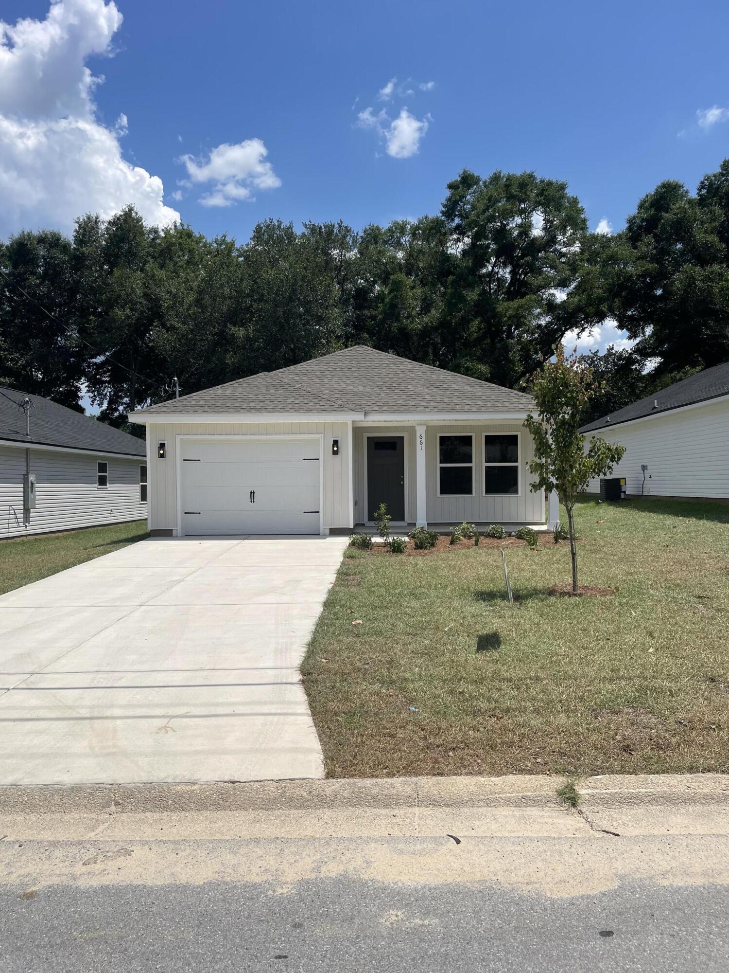 READY NOW WITH FREE REFRIGERATOR/BLINDS/WASHER & DRYER - CONVENIENT MID-TOWN LOCATION - CONSTRUCTION COMPLETE- BUDGET FRIENDLY - All packed into the 'Scarlett' floor plan. Seller will contribute up to $11,000 towards buyers closing costs (call for details). Vinyl plank flooring throughout, landscaped yard, front & rear porches for relaxing, finished garage. Raised ceilings, recessed lighting, quartz work island w/bar seating, corner walk-in pantry, walk-in closet in owner's bath w/double vanities, large laundry room, ceiling fans thru-out, white shaker style cabinets.