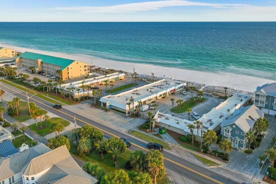 Quaint & Cozy Gulf Front condo ... just steps away from the white sandy beaches. Enjoy the newly remodeled  kitchen, while enjoying views of the Emerald green water. The property is situated on 300 feet of beach with private access, Enjoy Gulf views from two community decks, plus a barbecue area for outdoor dining. A perennial rental favorite generating $40,478 in  gross income in 2025 .... an astounding 8.9% ROI based on list price!  A new roof was just installed, with a 10 year warranty, transferable to a new owner. Unit has just been freshly repainted.