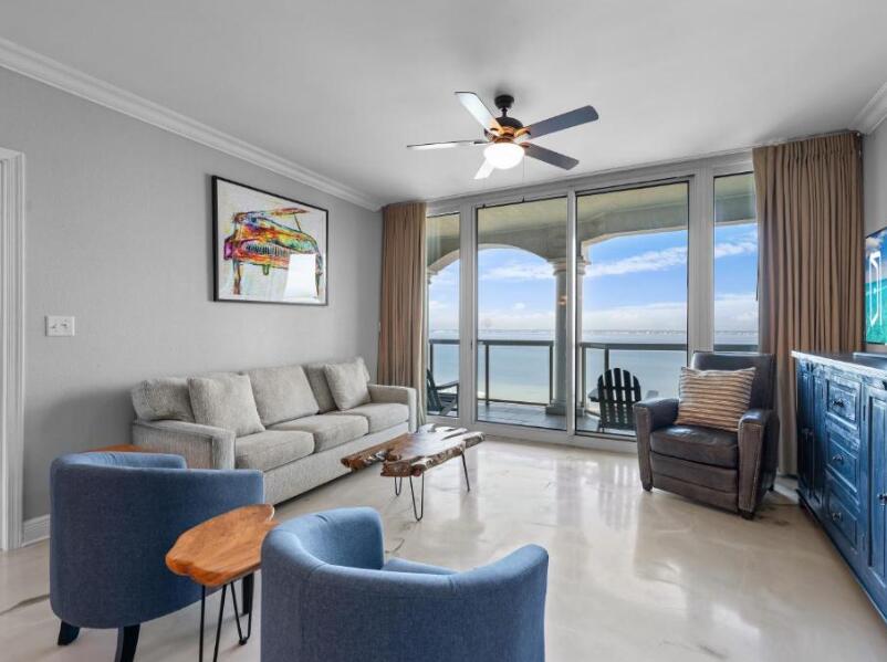 Views that stop you in your tracks. Blues that belong on a postcard. Residence 1106 at Portofino Tower 5 delivers the kind of coastal living people dream about, with panoramic water views, a generous balcony made for morning coffee, sunset toasts, and endless sea breezes, and interiors that feel straight from the pages of a design magazine. This turnkey 2-bedroom, 2.5-bath residence features chic modern finishes, private en-suite bedrooms, and a serene primary suite with a spa-inspired bath and soaking tub. Located within one of Southern Living Magazine's ''10 Best Family-Friendly Beach Hotels in Florida,'' owners enjoy an exceptional collection of resort amenities including Spa Portofino, private pools, fitness center, five clay tennis courts, on-site dining, and exclusive deeded beach access on both the Gulf and Sound sides. Miles of uncrowded sugar-white sand beaches await, with owner beach service, chairs, and umbrellas provided for effortless days by the water. Come for the views. Stay for the lifestyle.