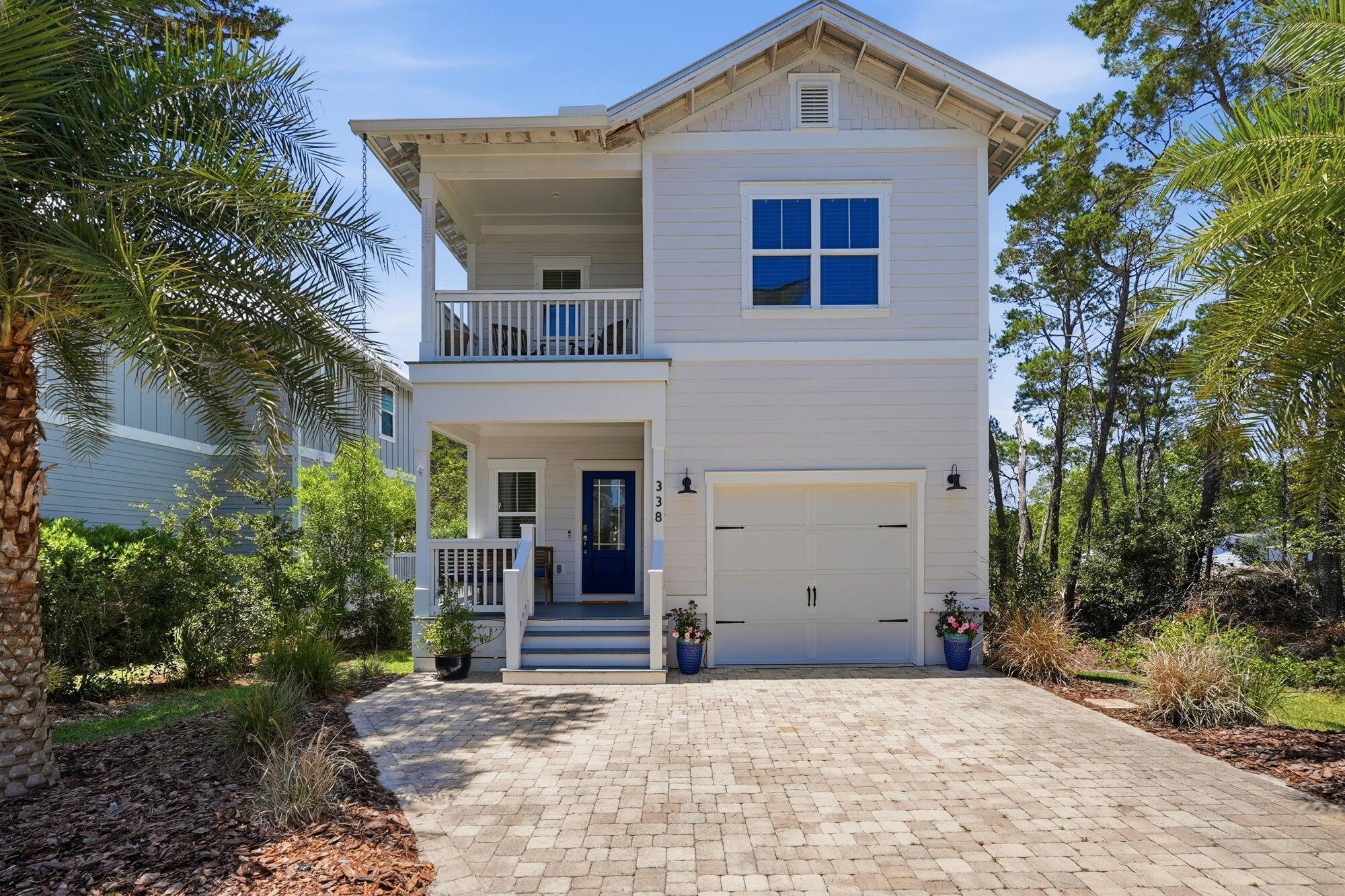 Tucked between the rare beauty of Lake Powell--one of the world's largest coastal dune lakes--and the emerald waters of the Gulf, 338 Grande Pointe Circle offers an exceptional opportunity to experience the best of the 30A lifestyle.

This fully furnished three-bedroom, two-and-a-half-bath Monroe floor plan blends timeless ''Old Florida'' charm with a refined coastal aesthetic, ideally positioned along the East end of Scenic Highway 30A. Within Grande Pointe, residents enjoy golf-cart-friendly streets, scenic bike paths, and convenient access to Rosemary Beach, Inlet Beach, and the dining, shopping, and entertainment of both 30A and Panama City Beach.

Designed for both full-time living and investment potential, the home offers approximately 1,840 square feet of thoughtfully designed living space, complete with a private one-car garage, additional outdoor storage, and a fenced, hardscaped backyard featuring a private spa hot tub for elevated relaxation. Inside, 10-foot ceilings and hardwood flooring create an inviting atmosphere throughout the open-concept first floor. The living and dining areas flow seamlessly into a bright coastal kitchen featuring a large granite island, upgraded tile backsplash, premium stainless steel appliances, and abundant space for entertaining. A convenient first-floor powder bath adds functionality for guests. 

Upstairs, the spacious primary suite offers a private balcony, dual closets, and a well-appointed en-suite bath featuring dual granite vanities, a soaking tub, and walk-in tiled shower. Two expansive guest bedrooms are serviced by a full bath complete with an extended granite vanity, custom cabinet hardware, and tiled tub/shower combination.

Bordering the protected beauty of Camp Helen State Park and the serene waters of Lake Powell, Grande Pointe offers private access to a dock and kayak launch, along with resort-style amenities including a lakefront pool and clubhouse. As well as seamless access to multiple beach access points, some of which offer ample public parking and restroom availability. Whether seeking a primary residence, second home, or short-term rental investment, this hidden coastal retreat delivers the perfect blend of natural beauty, modern comfort, and effortless access to the 30A lifestyle.